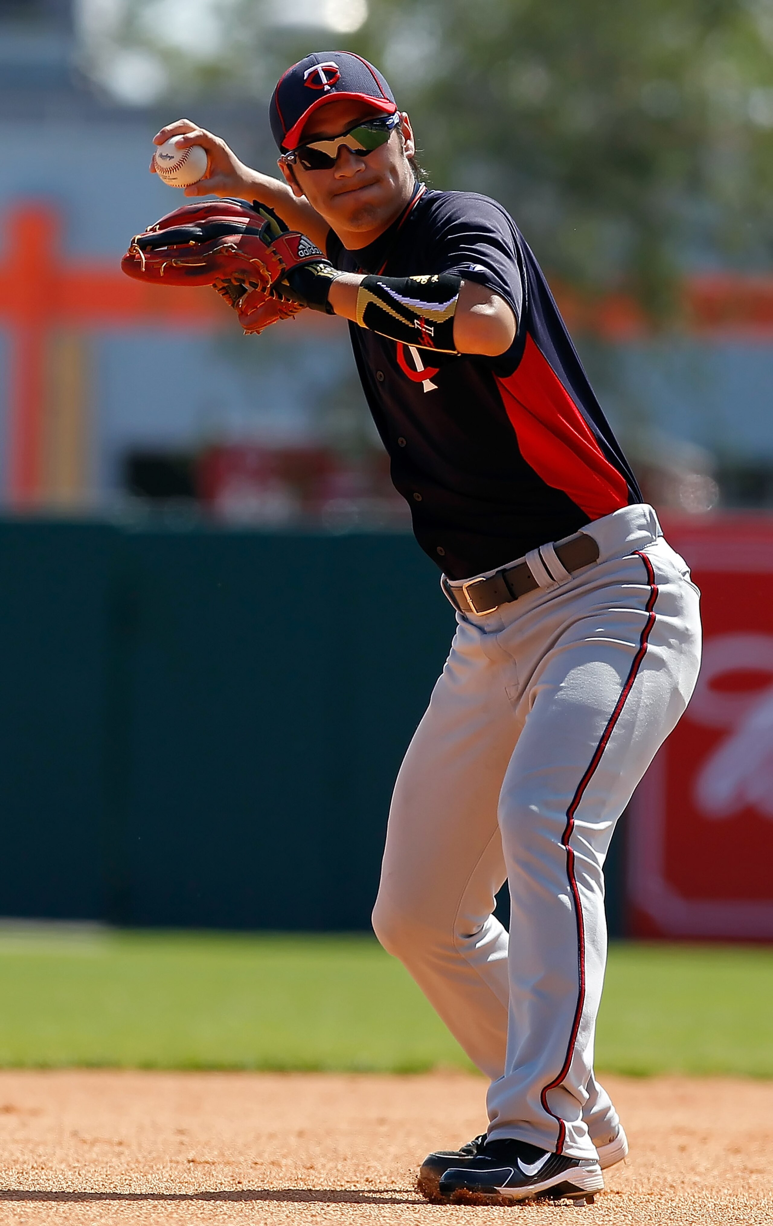 SARASOTA, FL - MARCH 03:  Infielder Tsuyoshi Nishioka #1 of the Minnesota Twins throws the ball against the Baltimore Orioles during a Grapefruit League Spring Training Game at Ed Smith Stadium on March 3, 2011 in Sarasota, Florida.  (Photo by J. Meric/Ge