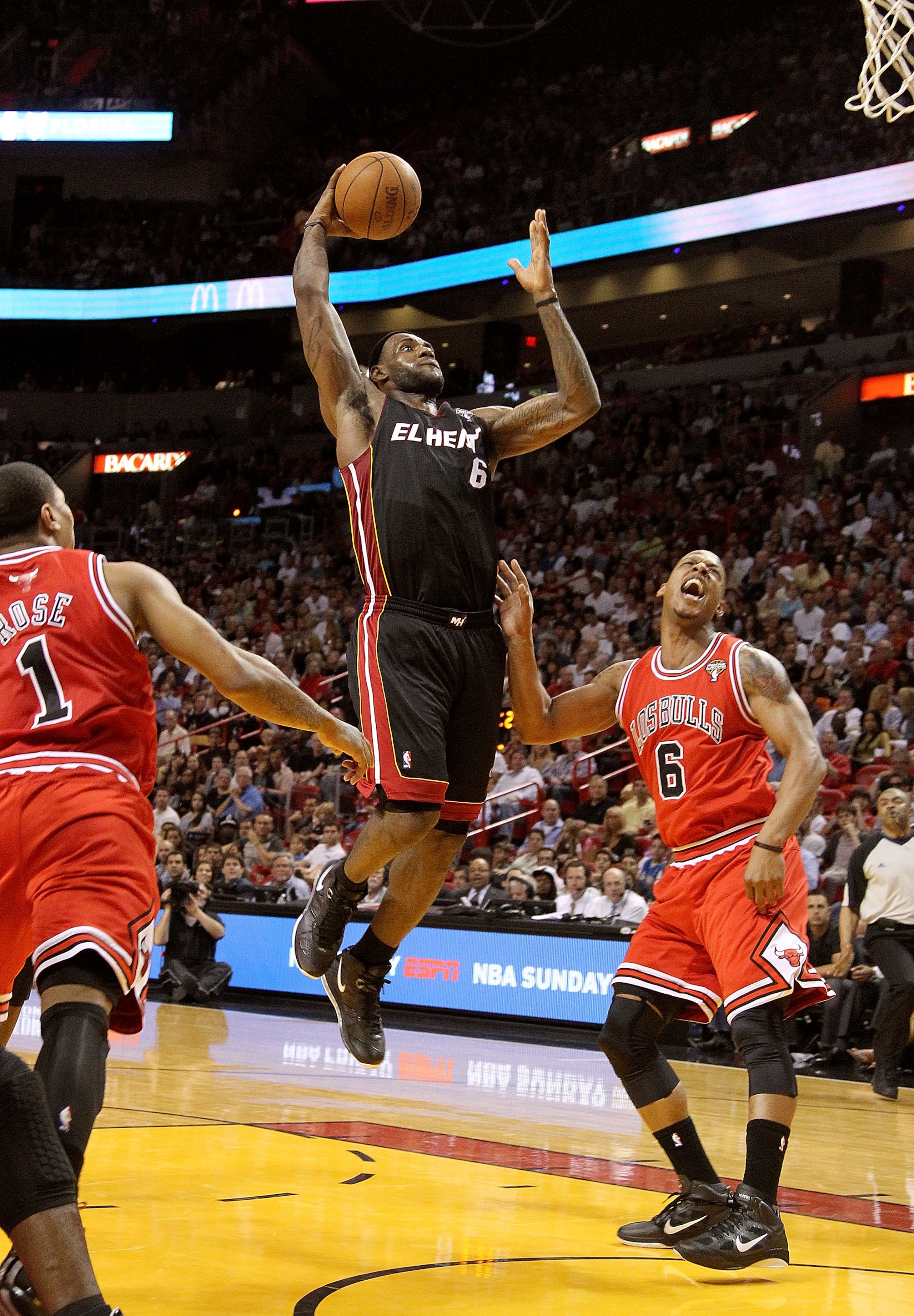 MIAMI, FL - MARCH 06: LeBron James #6 of the Miami Heat shoots over Keith Bogans #6 of the Chicago Bulls during a game at American Airlines Arena on March 6, 2011 in Miami, Florida. NOTE TO USER: User expressly acknowledges and agrees that, by downloadin MIAMI, FL - MARCH 06: LeBron James #6 of the Miami Heat shoots over Keith Bogans #6 of the Chicago Bulls during a game at American Airlines Arena on March 6, 2011 in Miami, Florida. NOTE TO USER: User expressly acknowledges and agrees that, by downloadin