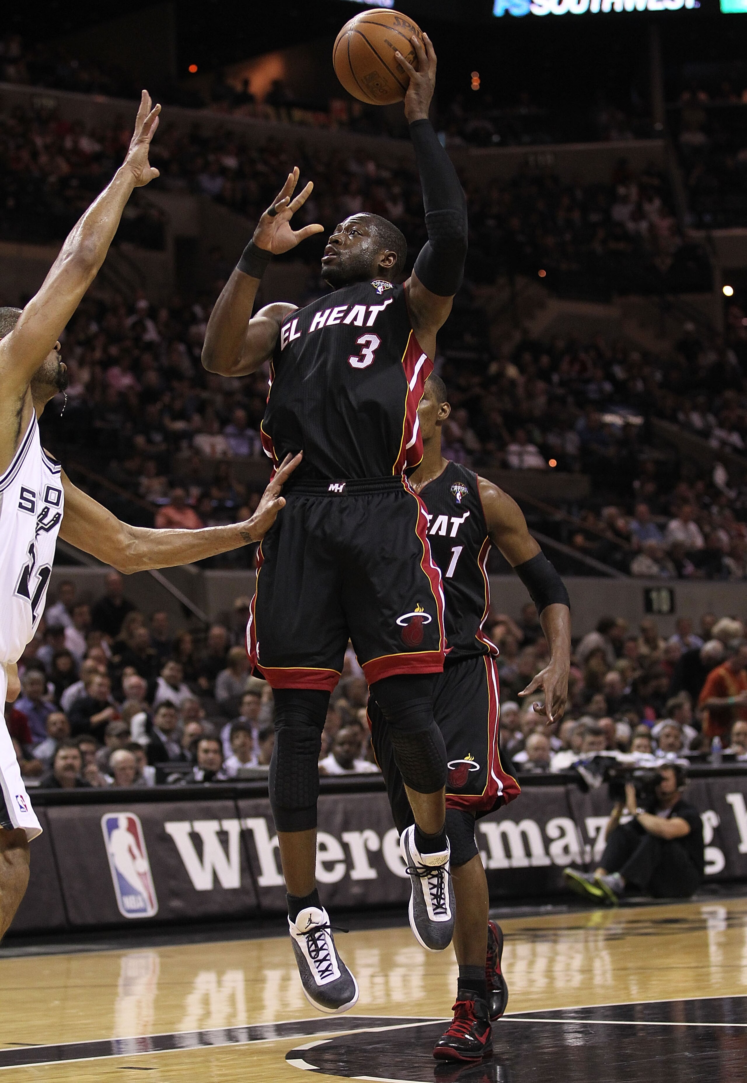 SAN ANTONIO, TX - MARCH 04: Guard Dwyane Wade #3 of the Miami Heat takes a shot against the San Antonio Spurs at AT&T Center on March 4, 2011 in San Antonio, Texas. NOTE TO USER: User expressly acknowledges and agrees that, by downloading and or using SAN ANTONIO, TX - MARCH 04: Guard Dwyane Wade #3 of the Miami Heat takes a shot against the San Antonio Spurs at AT&T Center on March 4, 2011 in San Antonio, Texas. NOTE TO USER: User expressly acknowledges and agrees that, by downloading and or using