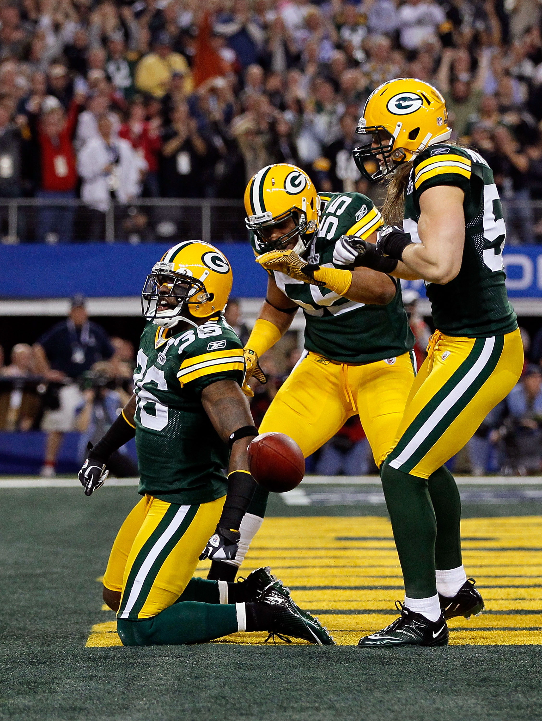 ARLINGTON, TX - FEBRUARY 06: (L-R) Nick Collins #36, Desmond Bishop #55 and Clay Matthews #52 of the Green Bay Packers celebrate after Collins scored a touchdown on an interception return against the Pittsburgh Steelers during Super Bowl XLV at Cowboys S ARLINGTON, TX - FEBRUARY 06: (L-R) Nick Collins #36, Desmond Bishop #55 and Clay Matthews #52 of the Green Bay Packers celebrate after Collins scored a touchdown on an interception return against the Pittsburgh Steelers during Super Bowl XLV at Cowboys S