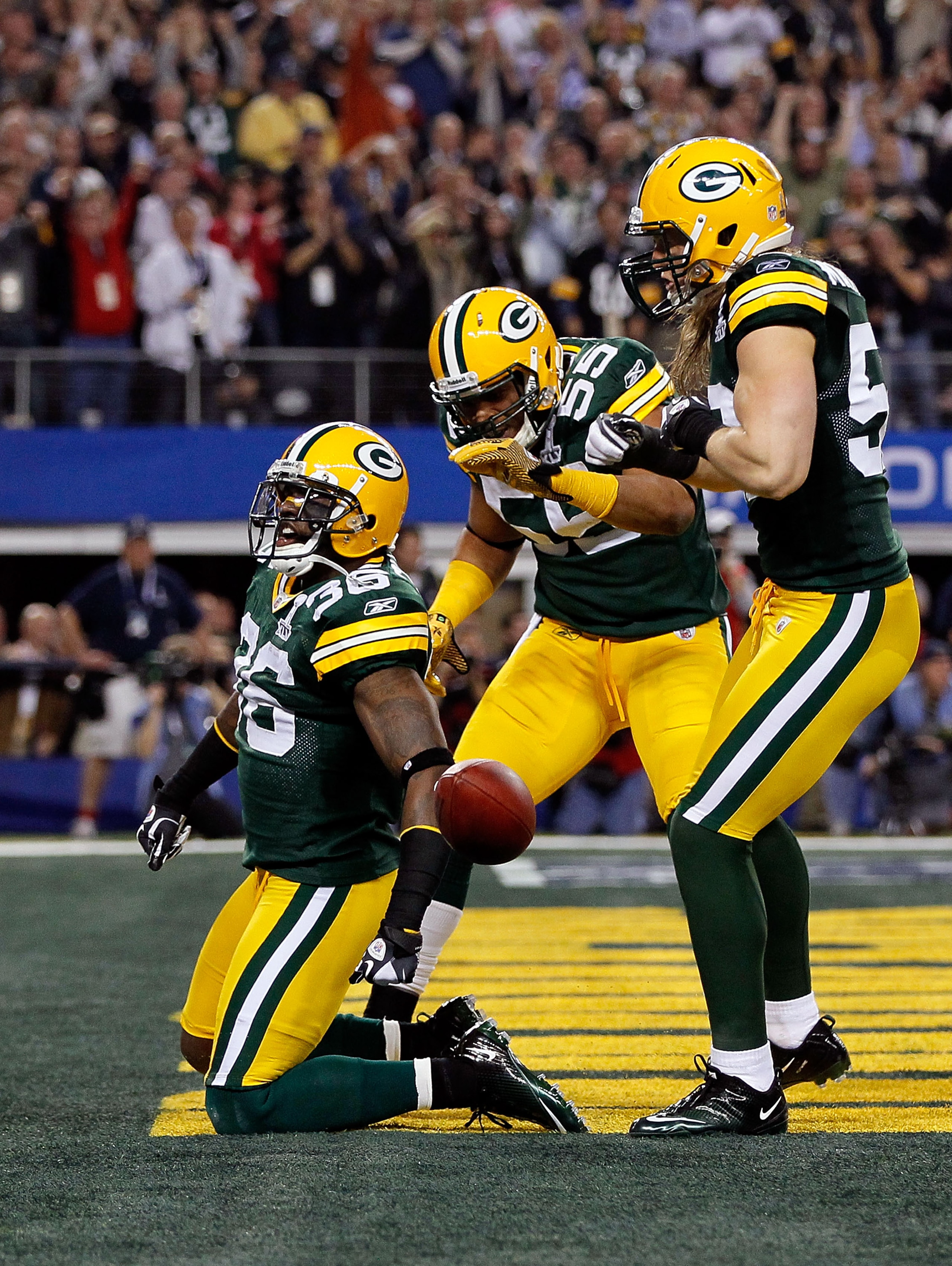 ARLINGTON, TX - FEBRUARY 06:  (L-R) Nick Collins #36, Desmond Bishop #55 and Clay Matthews #52 of the Green Bay Packers celebrate after Collins scored a touchdown on an interception return against the Pittsburgh Steelers during Super Bowl XLV at Cowboys S