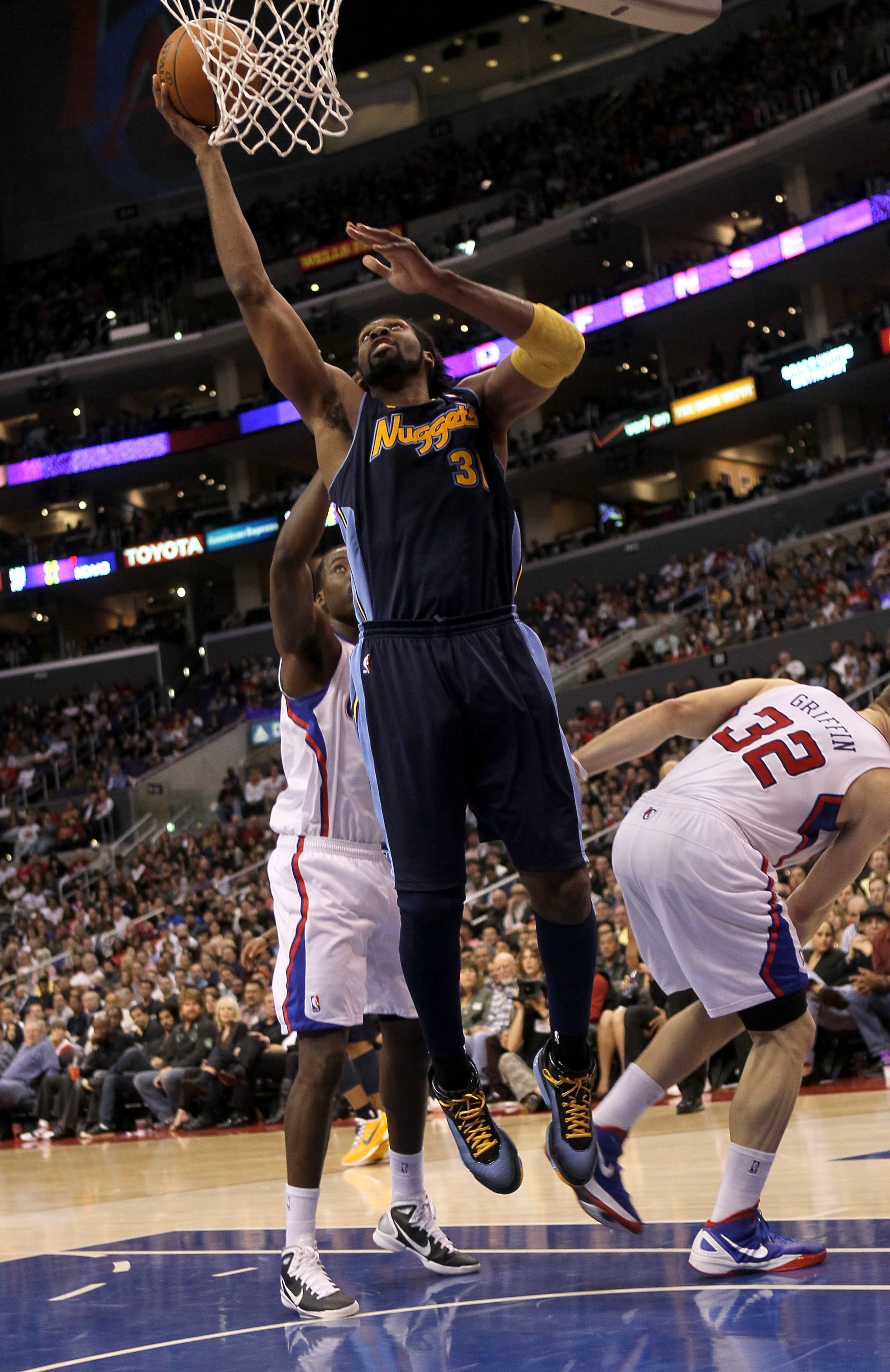 LOS ANGELES, CA - MARCH 5:  Nene #31 of the Denver Nuggets goes up for shot against the Los Angeles Clippers at Staples Center on March 5, 2011 in Los Angeles, California. The Clippers won 100-94. NOTE TO USER: User expressly acknowledges and agrees that,