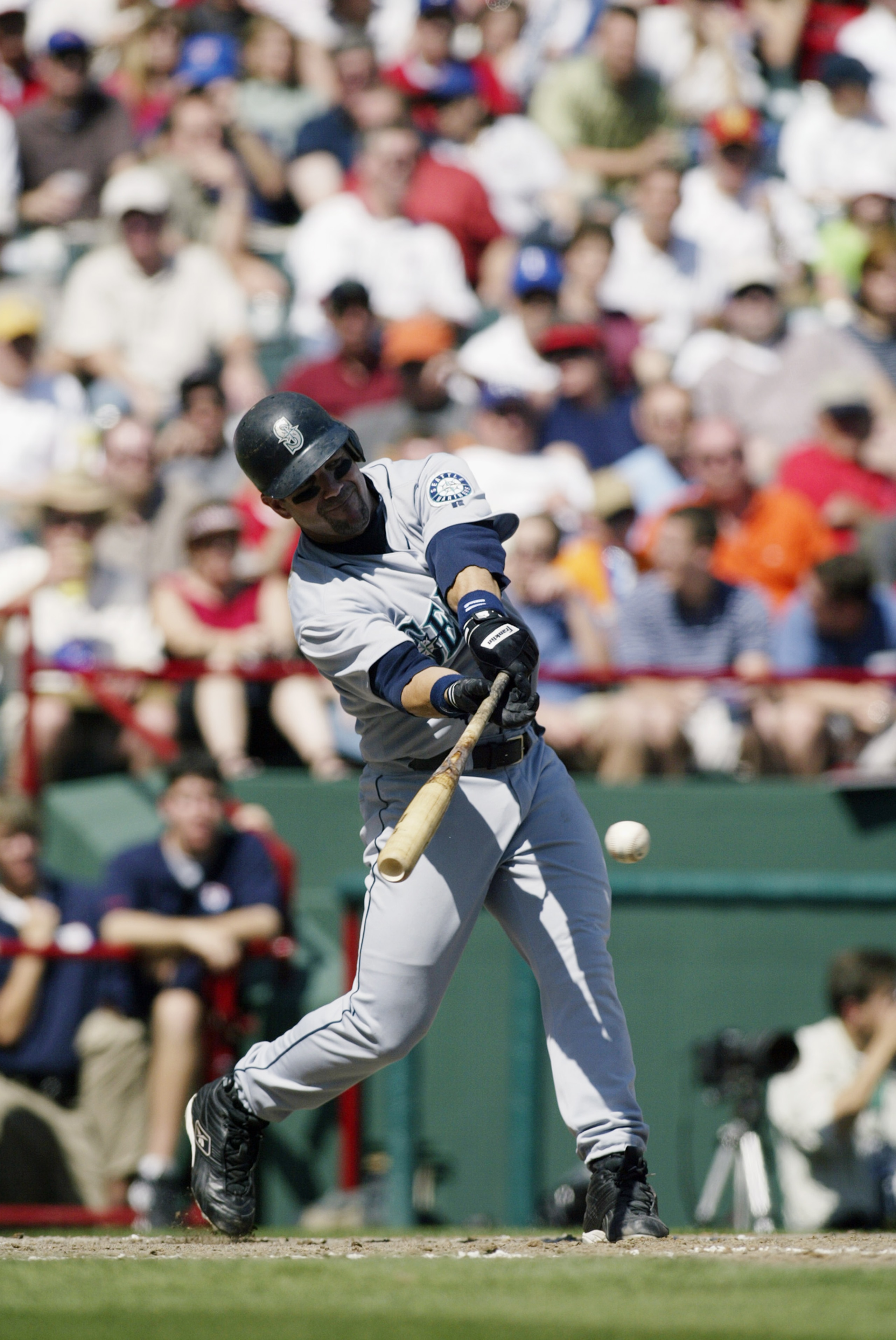ARLINGTON, TX - APRIL 4:  Designated hitter Edgar Martinez #11 of the Seattle Mariners hits against the Texas Rangers at the Ballpark in Arlington on April 4, 2003 in Arlington, Texas. The Mariners defeated the Rangers 6-4. (Photo by Ronald Martinez/Getty