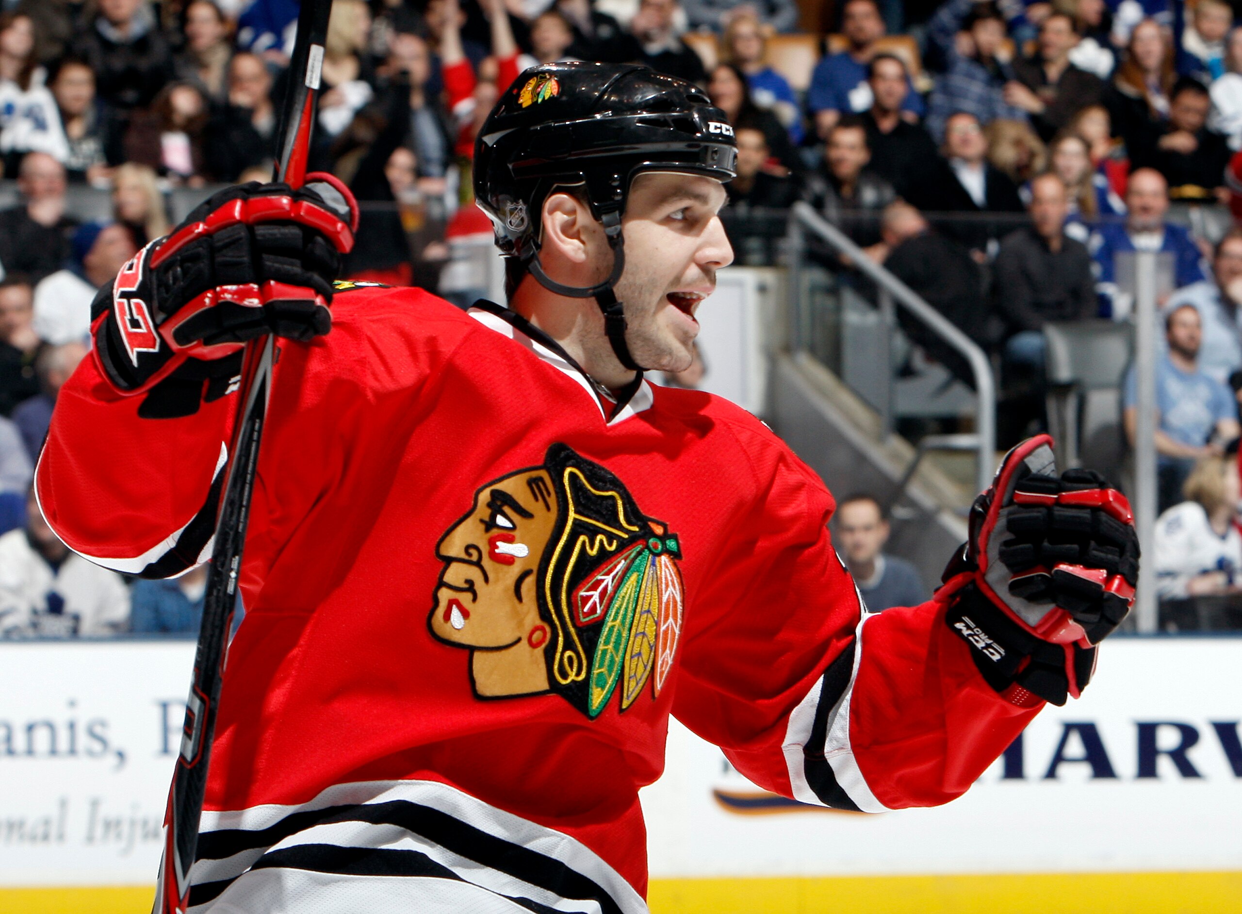 TORONTO, CANADA - MARCH 5: Jake Dowell #28 of the Chicago Blackhawks celebrates the goal of teammate Michael Frolik #67 during game action against the Toronto Maple Leafs at the Air Canada Centre March 5, 2011 in Toronto, Ontario, Canada. (Photo by Abelim