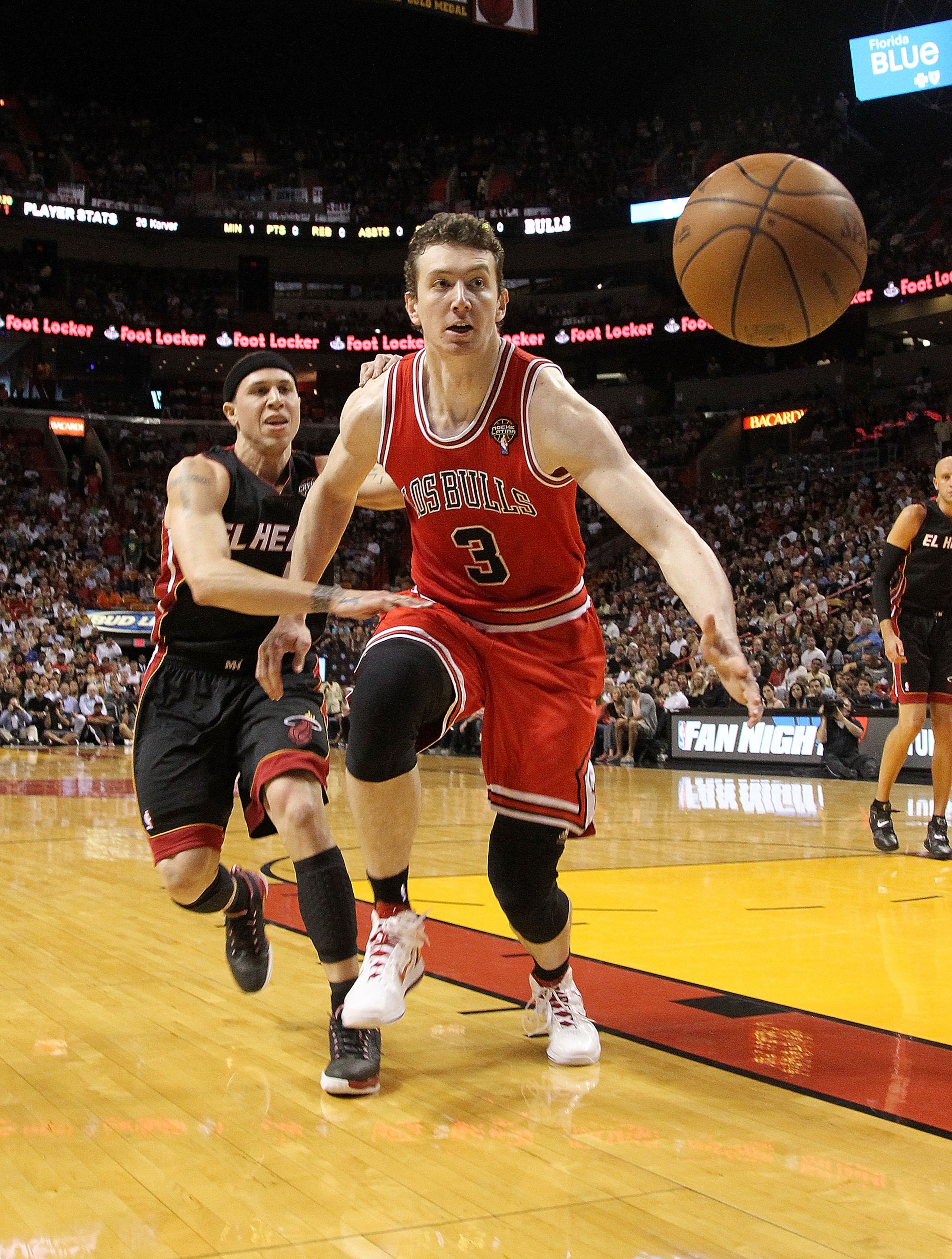 MIAMI, FL - MARCH 06:  Omer Asik #3 of the Chicago Bulls chases a ball out of bounds during a game against the Miami Heat at American Airlines Arena on March 6, 2011 in Miami, Florida. NOTE TO USER: User expressly acknowledges and agrees that, by download