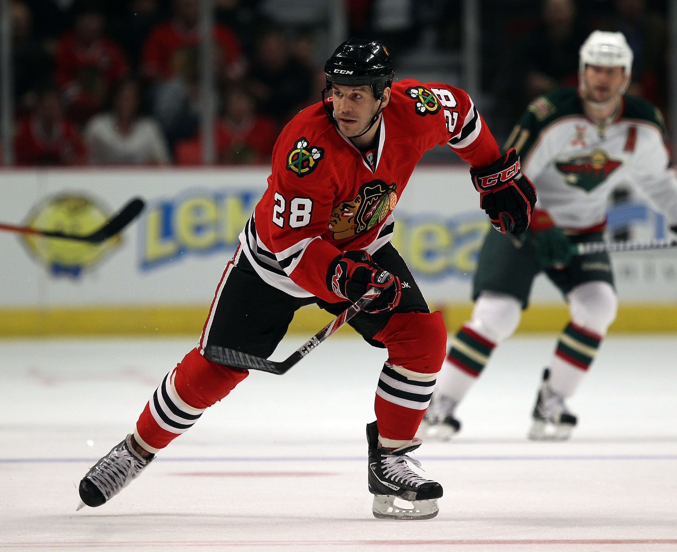CHICAGO, IL - FEBRUARY 16: Jake Dowell #28 of the Chicago Blackhawks skates up the ice against the Minnesota Wild at the United Center on February 16, 2011 in Chicago, Illinois. The Blackhawks defeated the Wild 3-1.  (Photo by Jonathan Daniel/Getty Images
