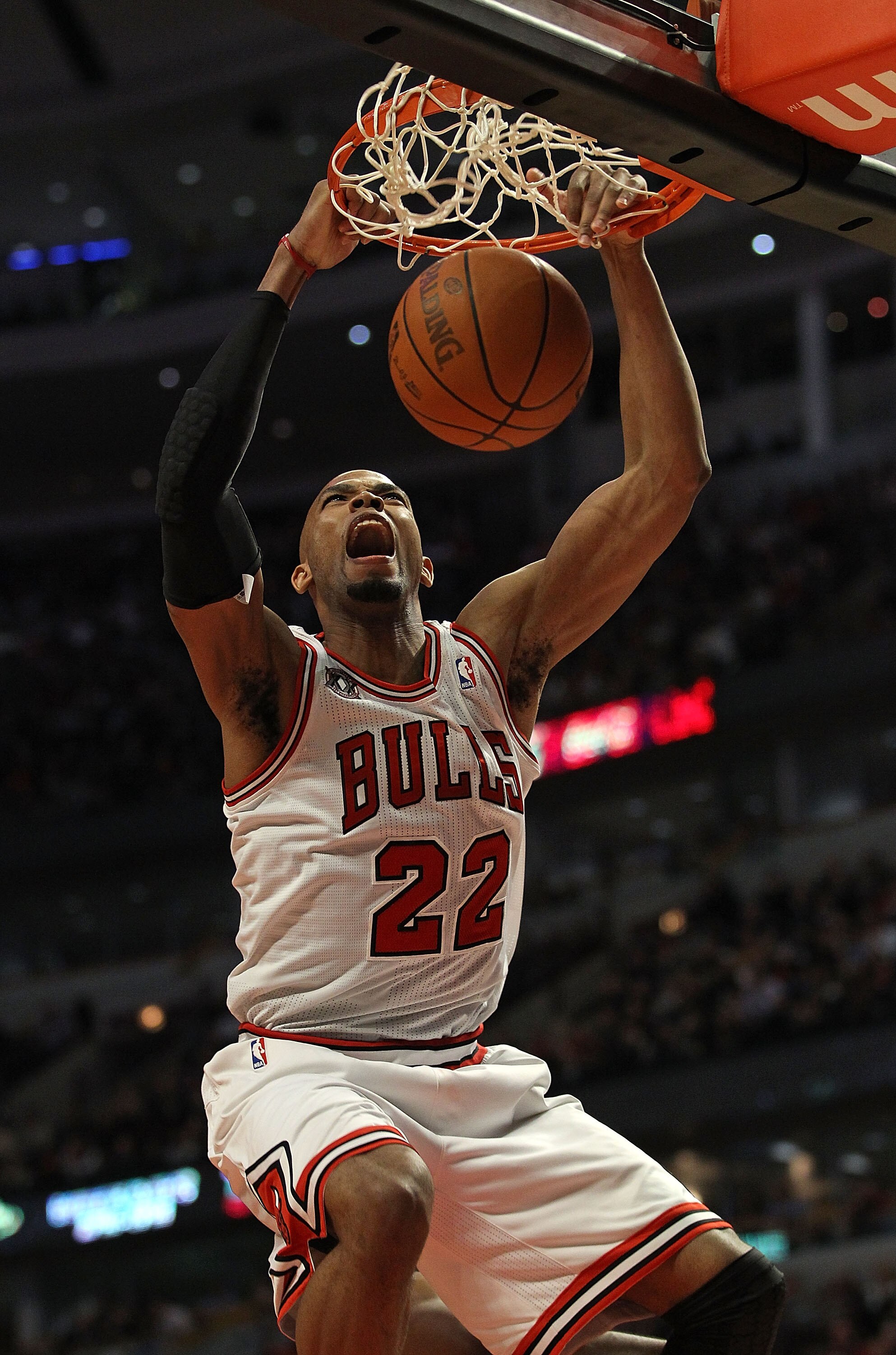 CHICAGO, IL - MARCH 07: Taj Gibson #22 of the Chicago Bulls dunks the ball against the New Orleans Hornets at the United Center on March 7, 2011 in Chicago, Illinois. The Bulls defeated the Hornets 85-77. NOTE TO USER: User expressly acknowledges and agre