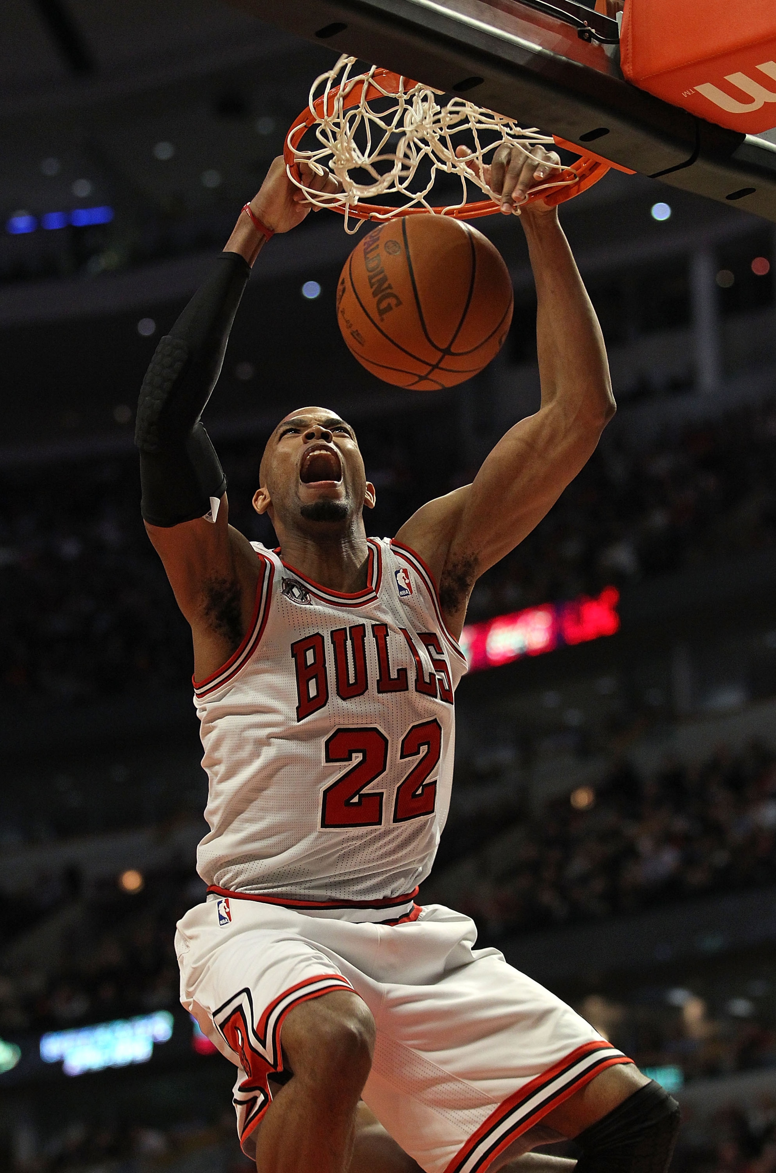 CHICAGO, IL - MARCH 07: Taj Gibson #22 of the Chicago Bulls dunks the ball against the New Orleans Hornets at the United Center on March 7, 2011 in Chicago, Illinois. The Bulls defeated the Hornets 85-77. NOTE TO USER: User expressly acknowledges and agre