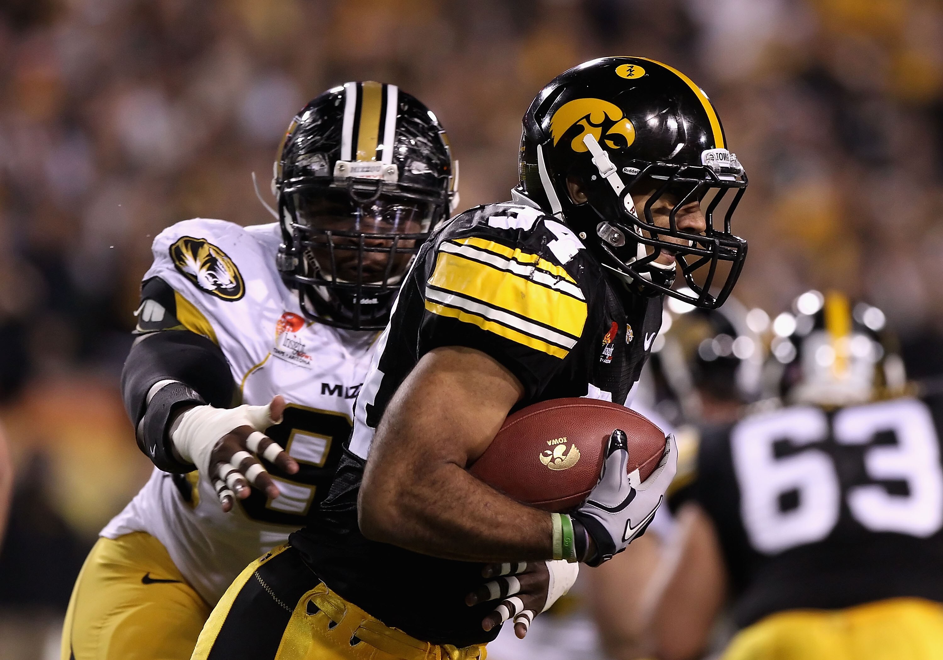 TEMPE, AZ - DECEMBER 28:  Runningback Marcus Coker #34 of the Iowa Hawkeyes rushes the football against the Missouri Tigers during the Insight Bowl at Sun Devil Stadium on December 28, 2010 in Tempe, Arizona.  (Photo by Christian Petersen/Getty Images)