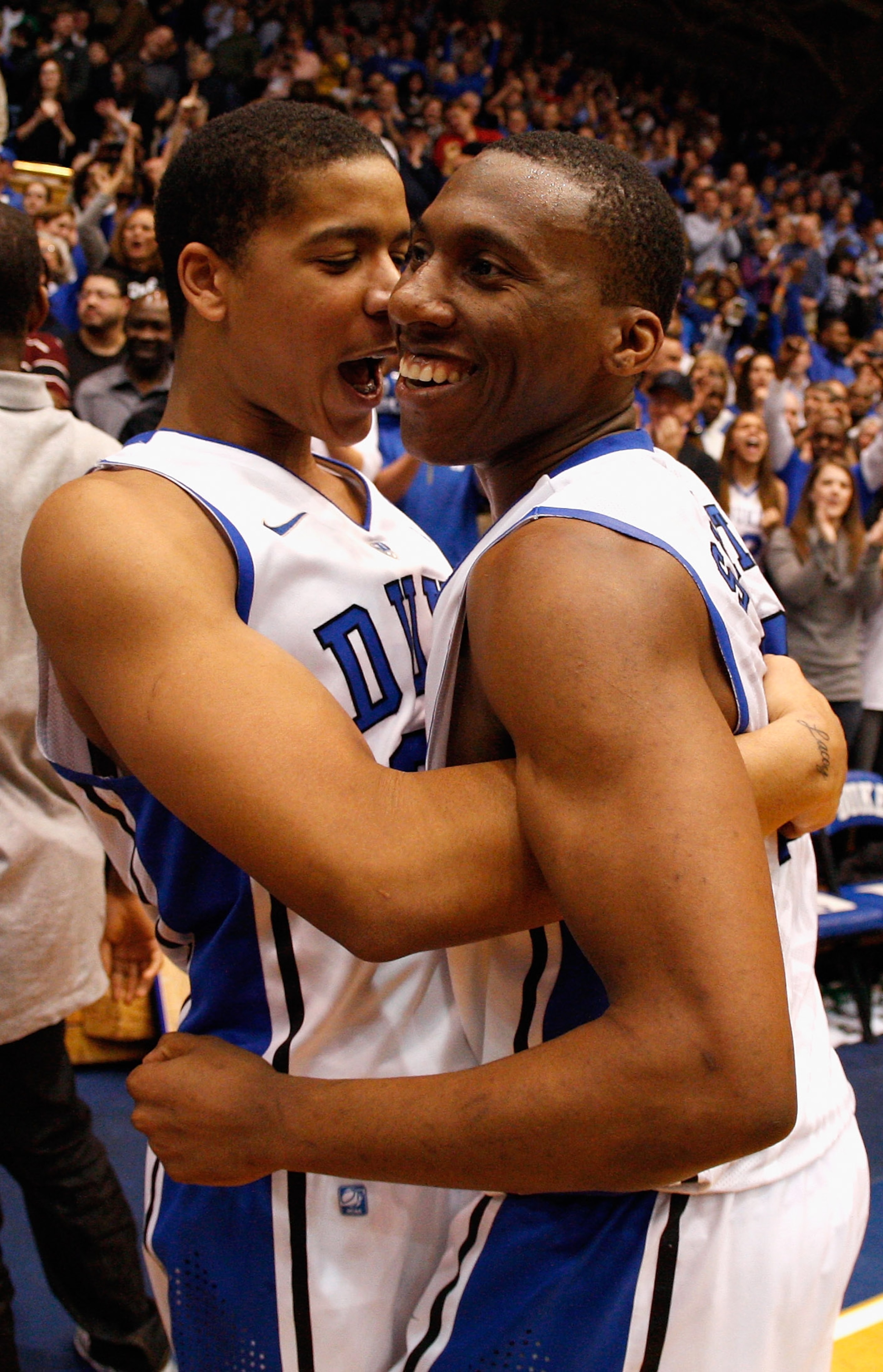 DURHAM, NC - FEBRUARY 09:  Andre Dawkins #20 of the Duke Blue Devils celebrates with teammate Nolan Smith #2 after defeating the North Carolina Tar heels 79-73 during their game at Cameron Indoor Stadium on February 9, 2011 in Durham, North Carolina.  (Ph