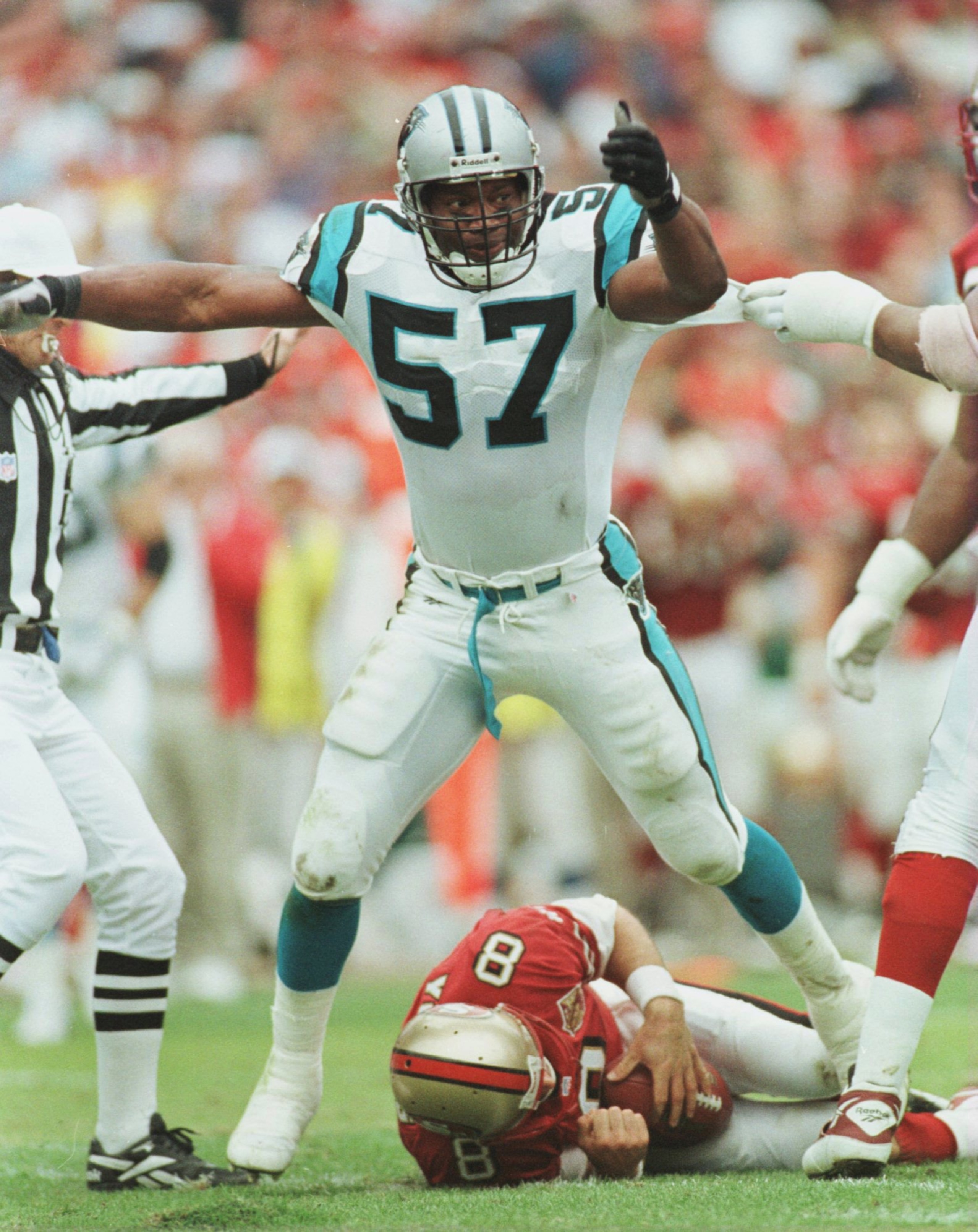 8 Dec 1996:  Lamar Lathon #57 of the Carolina Panters stands over quarterback Steve Young of the San Francisco 49ers after he was sacked in the second half during their game at 3Com Park in San Francisco, California. The Panthers beat the 49ers 30-24. Man