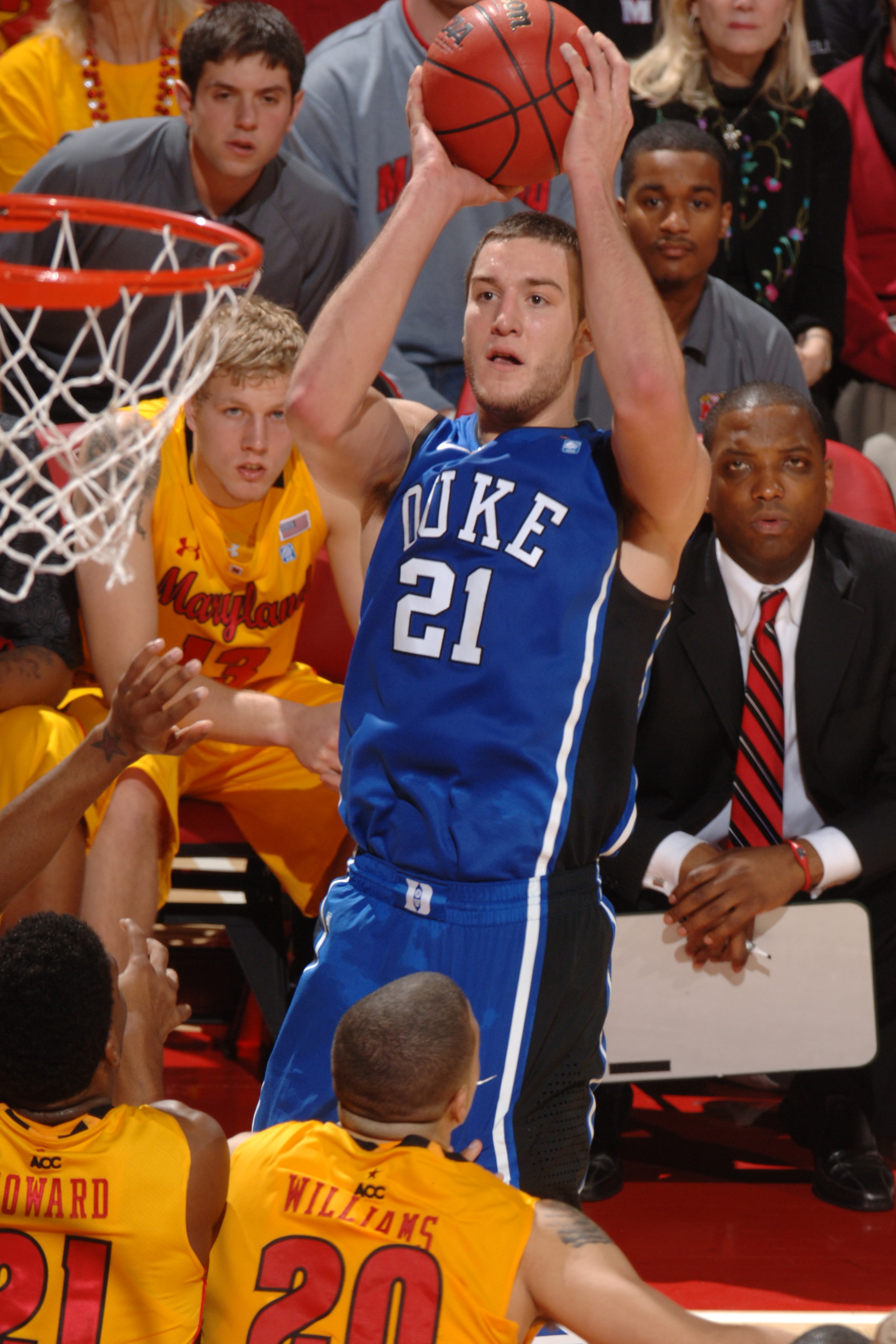 COLLEGE PARK, MD - FEBRUARY 2: Miles Plumlee #21 of the Duke Blue Devils takes a jump shot during a college basketball game against the Maryland Terrapins on February 2, 2011 at the Comcast Arena in College Park, Maryland. The Blue Devils won 80-62. (Phot COLLEGE PARK, MD - FEBRUARY 2: Miles Plumlee #21 of the Duke Blue Devils takes a jump shot during a college basketball game against the Maryland Terrapins on February 2, 2011 at the Comcast Arena in College Park, Maryland. The Blue Devils won 80-62. (Phot