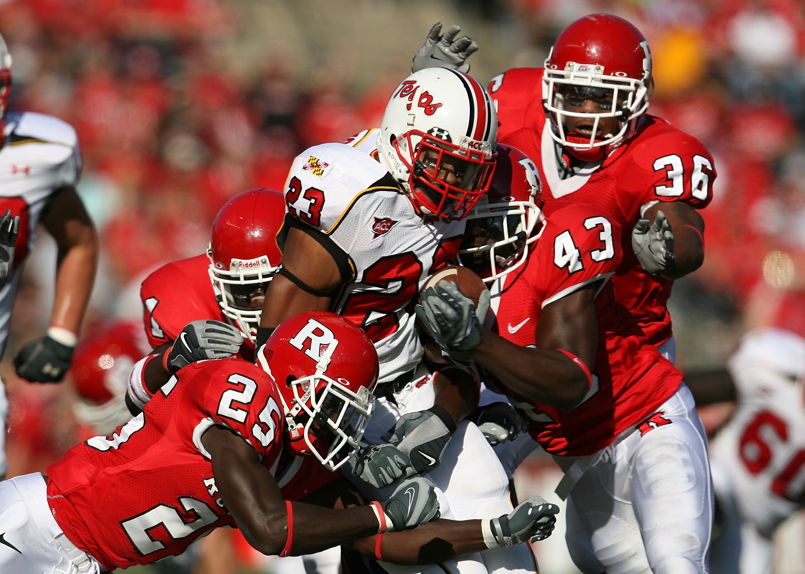 PISCATAWAY, NJ - SEPTEMBER 29: Jason McCourty #25 and Ron Girault #43 of the Rutgers Scarlet Knights tackle Da'Rel Scott #23 of the Maryland Terrapins during their game at Rutgers Stadium on September 29, 2007 in Piscataway, New Jersey. (Photo by Nick Lah PISCATAWAY, NJ - SEPTEMBER 29: Jason McCourty #25 and Ron Girault #43 of the Rutgers Scarlet Knights tackle Da'Rel Scott #23 of the Maryland Terrapins during their game at Rutgers Stadium on September 29, 2007 in Piscataway, New Jersey. (Photo by Nick Lah