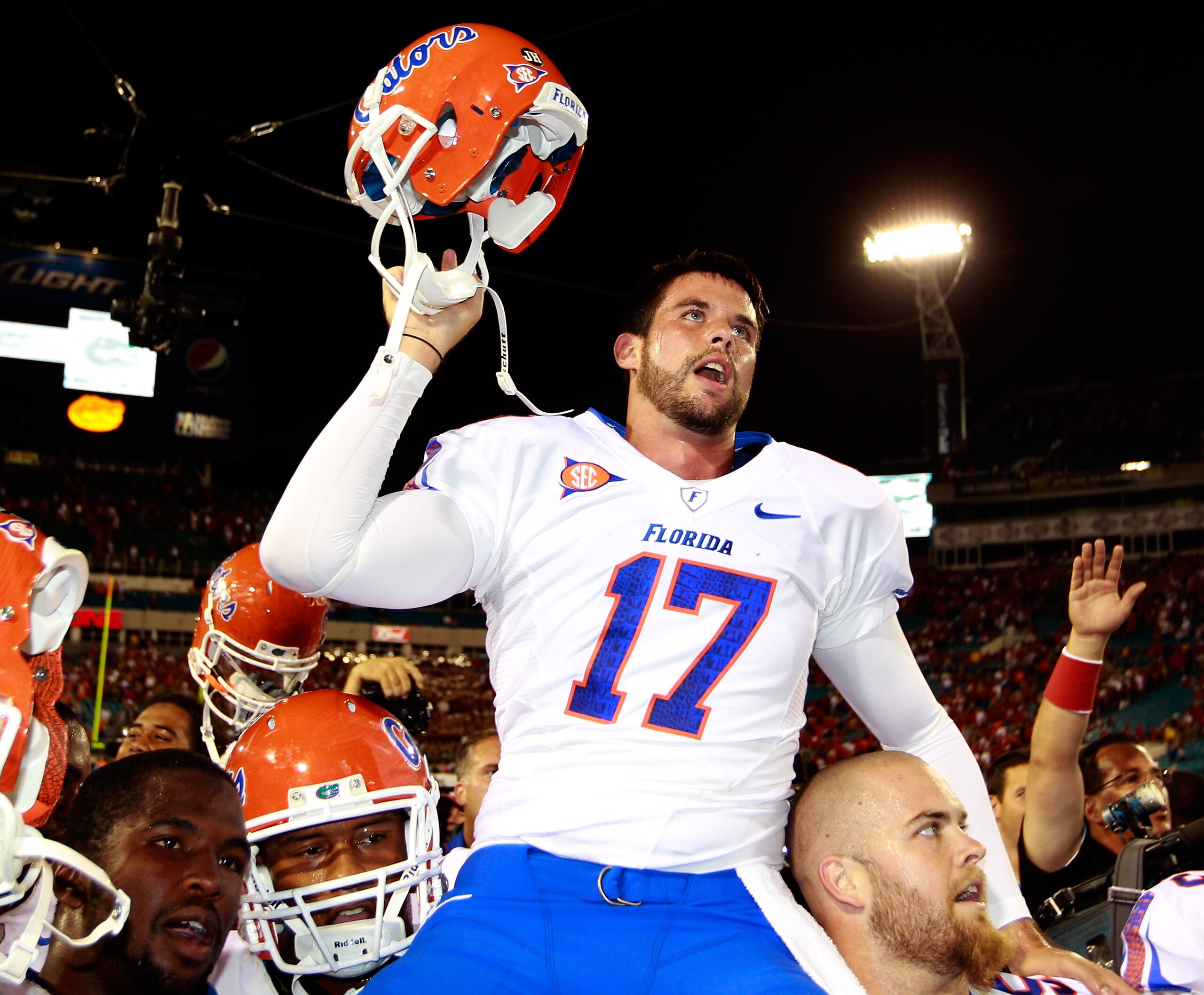 JACKSONVILLE, FL - OCTOBER 30: Chas Henry #17 of the Florida Gators raises his helmet in vicrtory following the game against the Georgia Bulldogs at EverBank Field on October 30, 2010 in Jacksonville, Florida. (Photo by Sam Greenwood/Getty Images) JACKSONVILLE, FL - OCTOBER 30: Chas Henry #17 of the Florida Gators raises his helmet in vicrtory following the game against the Georgia Bulldogs at EverBank Field on October 30, 2010 in Jacksonville, Florida. (Photo by Sam Greenwood/Getty Images)