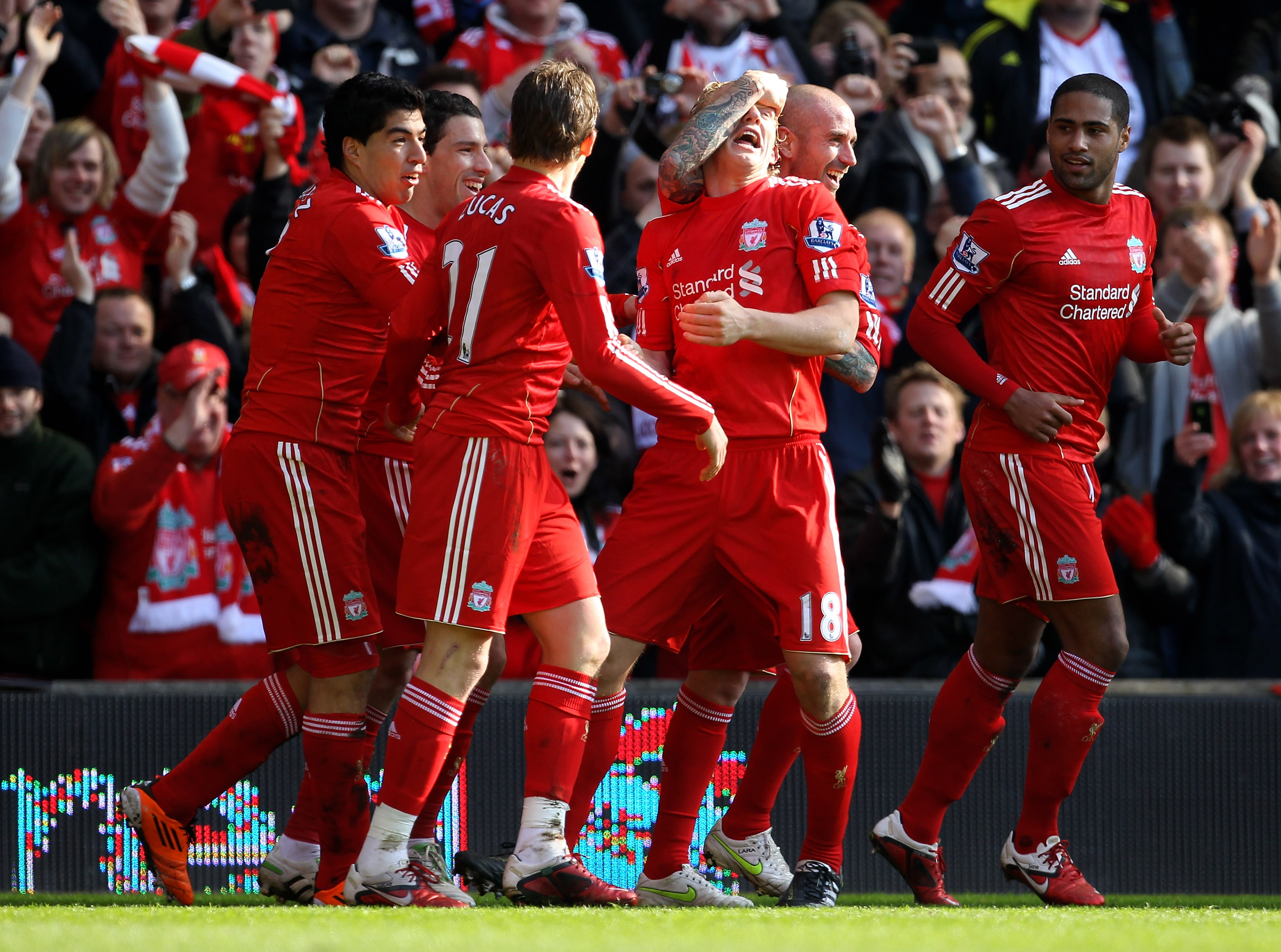 LIVERPOOL, ENGLAND - MARCH 06:  Dirk Kuyt of Liverpool celebrates scoring the opening goal with his team mates during the Barclays Premier League match between Liverpool and Manchester United at Anfield on March 6, 2011 in Liverpool, England.  (Photo by A