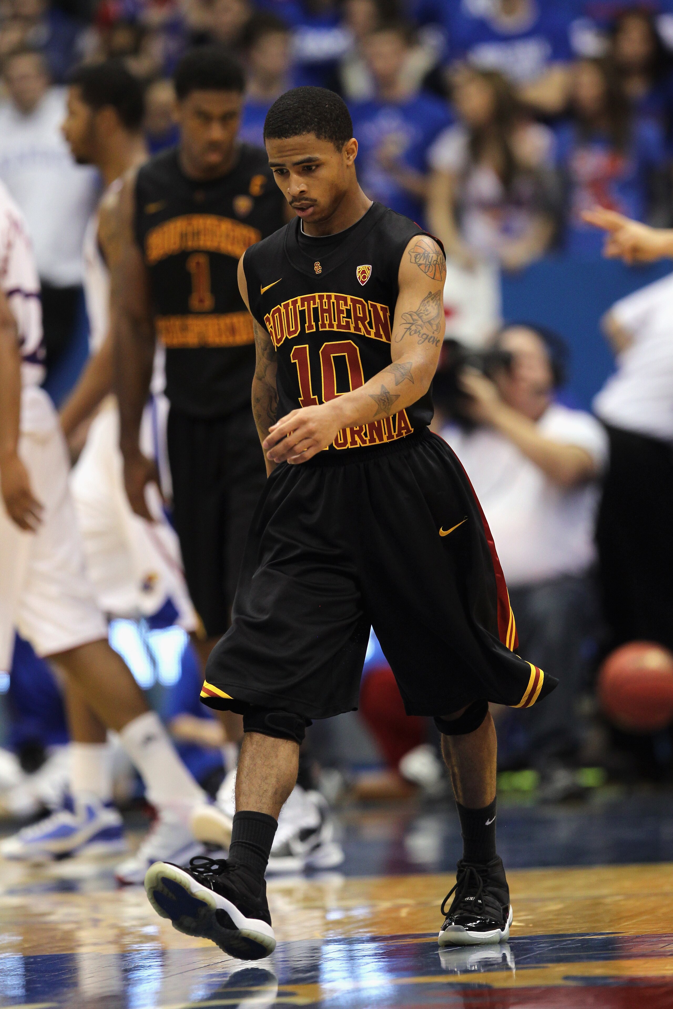 LAWRENCE, KS - DECEMBER 18:  Maurice Jones #10 of the USC Trojans walks off the court during a timeout in the game against the Kansas Jayhawks on December 18, 2010 at Allen Fieldhouse in Lawrence, Kansas.  (Photo by Jamie Squire/Getty Images)