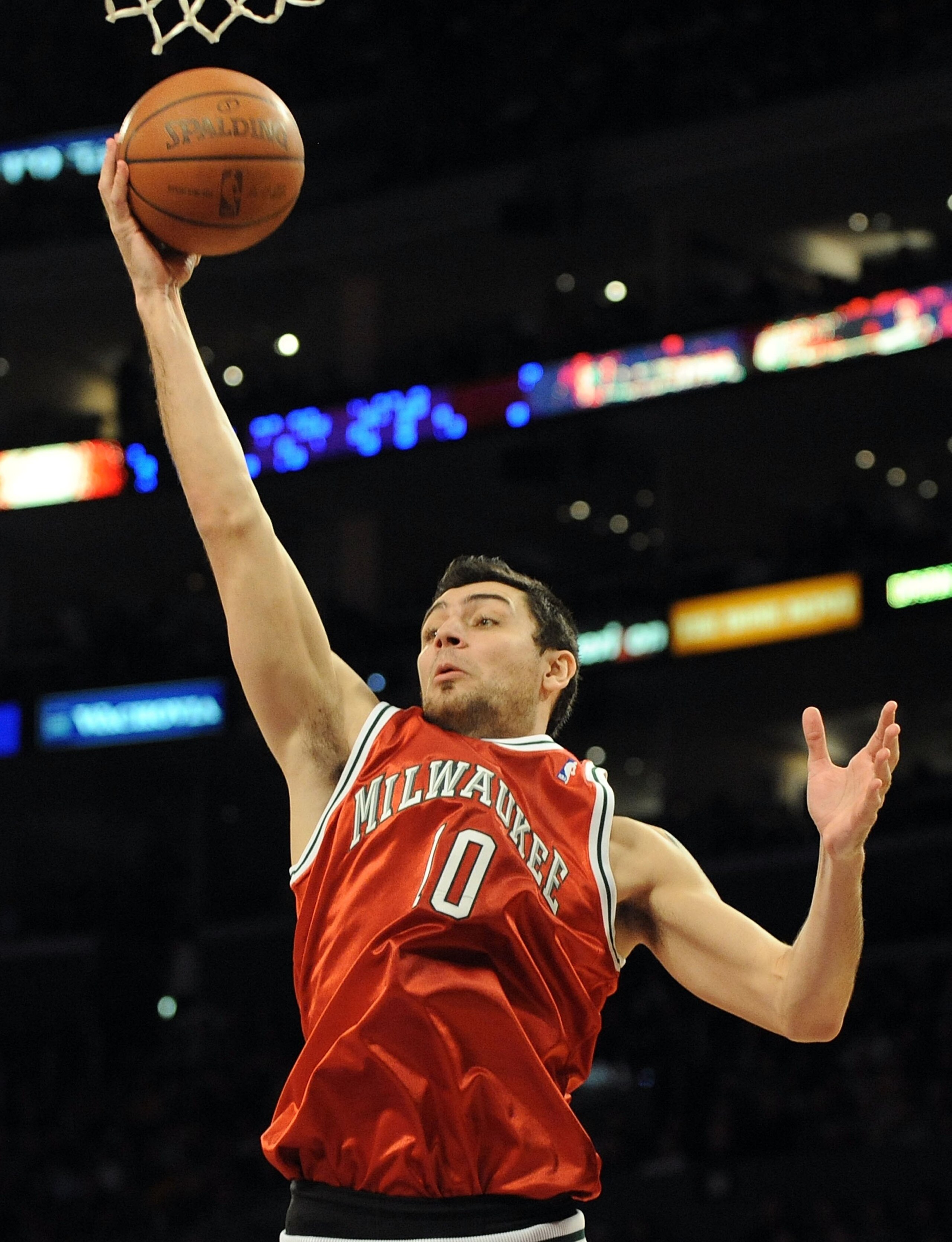 LOS ANGELES, CA - JANUARY 10:  Carlos Delfino #10 of the Milwaukee Bucks rebounds against the Los Angeles Lakers at Staples Center on January 10, 2010 in Los Angeles, California.  (Photo by Harry How/Getty Images)  NOTE TO USER: User expressly acknowledge