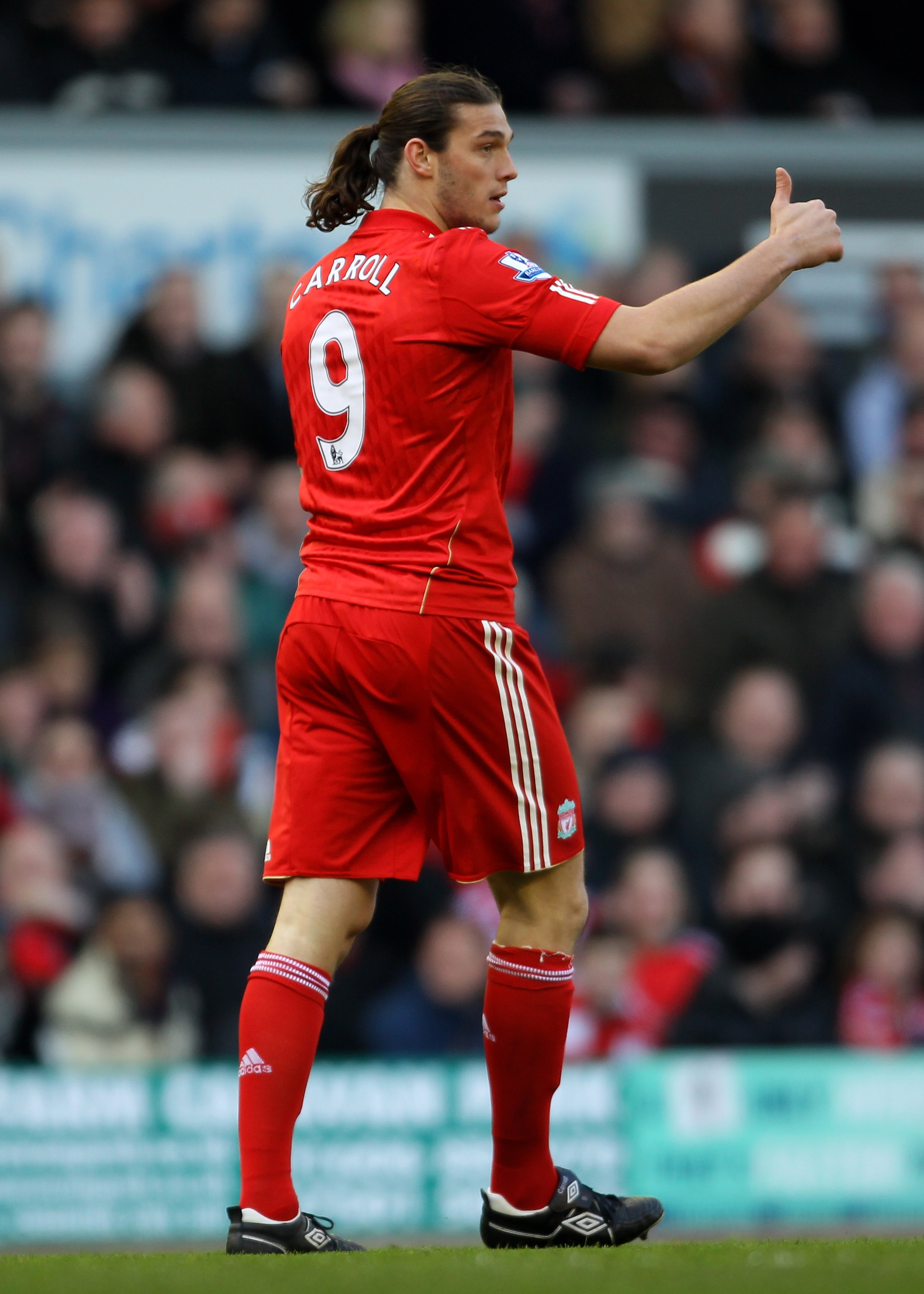 LIVERPOOL, ENGLAND - MARCH 06:  Andy Carroll of Liverpool gestures after coming on as a substitute to make his debut during the Barclays Premier League match between Liverpool and Manchester United at Anfield on March 6, 2011 in Liverpool, England.  (Phot