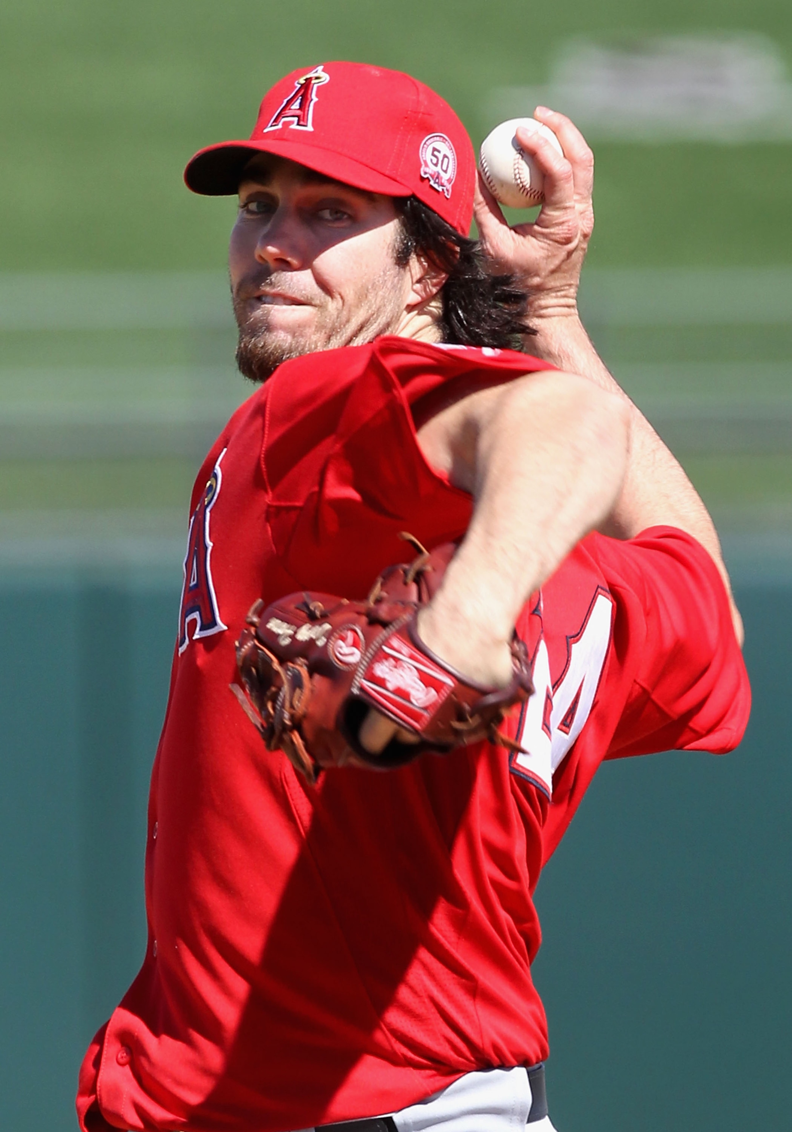 SURPRISE, AZ - MARCH 02:  Starting pitcher Dan Haren #24 of the Los Angeles Angels of Anaheim pitches against the Texas Rangers during the spring training game at Surprise Stadium on March 2, 2011 in Surprise, Arizona.  (Photo by Christian Petersen/Getty 