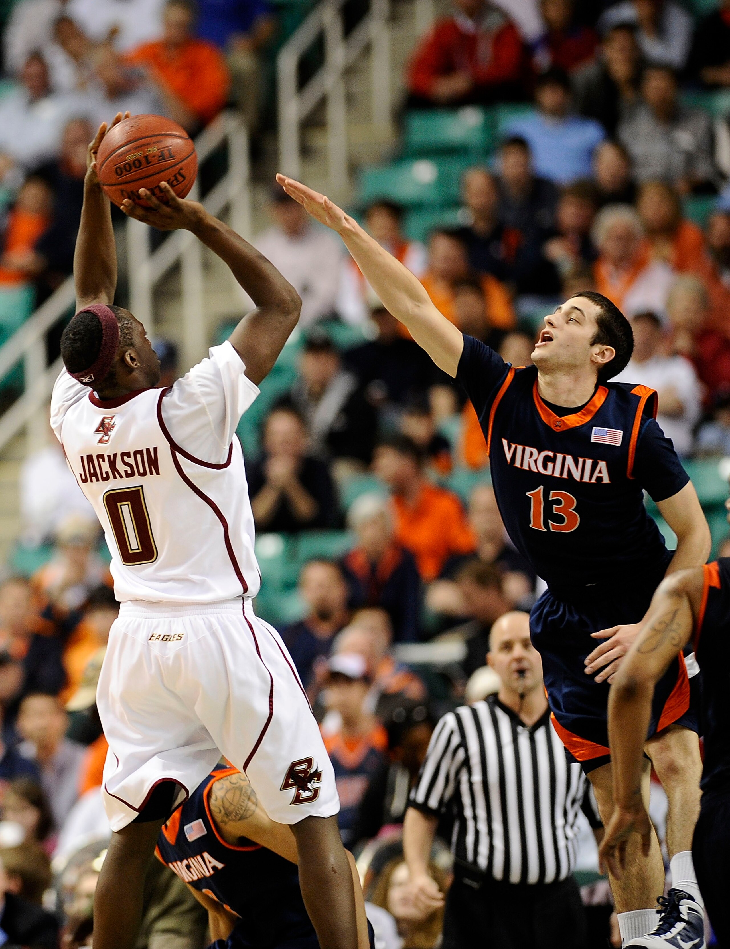GREENSBORO, NC - MARCH 11:  Sammy Zeglinski #13 of the University of Virginia Cavaliers guards Reggie Jackson #0 of the Boston College Eagles in their first round game in the 2010 ACC Men's Basketball Tournament at the Greensboro Coliseum on March 11, 201
