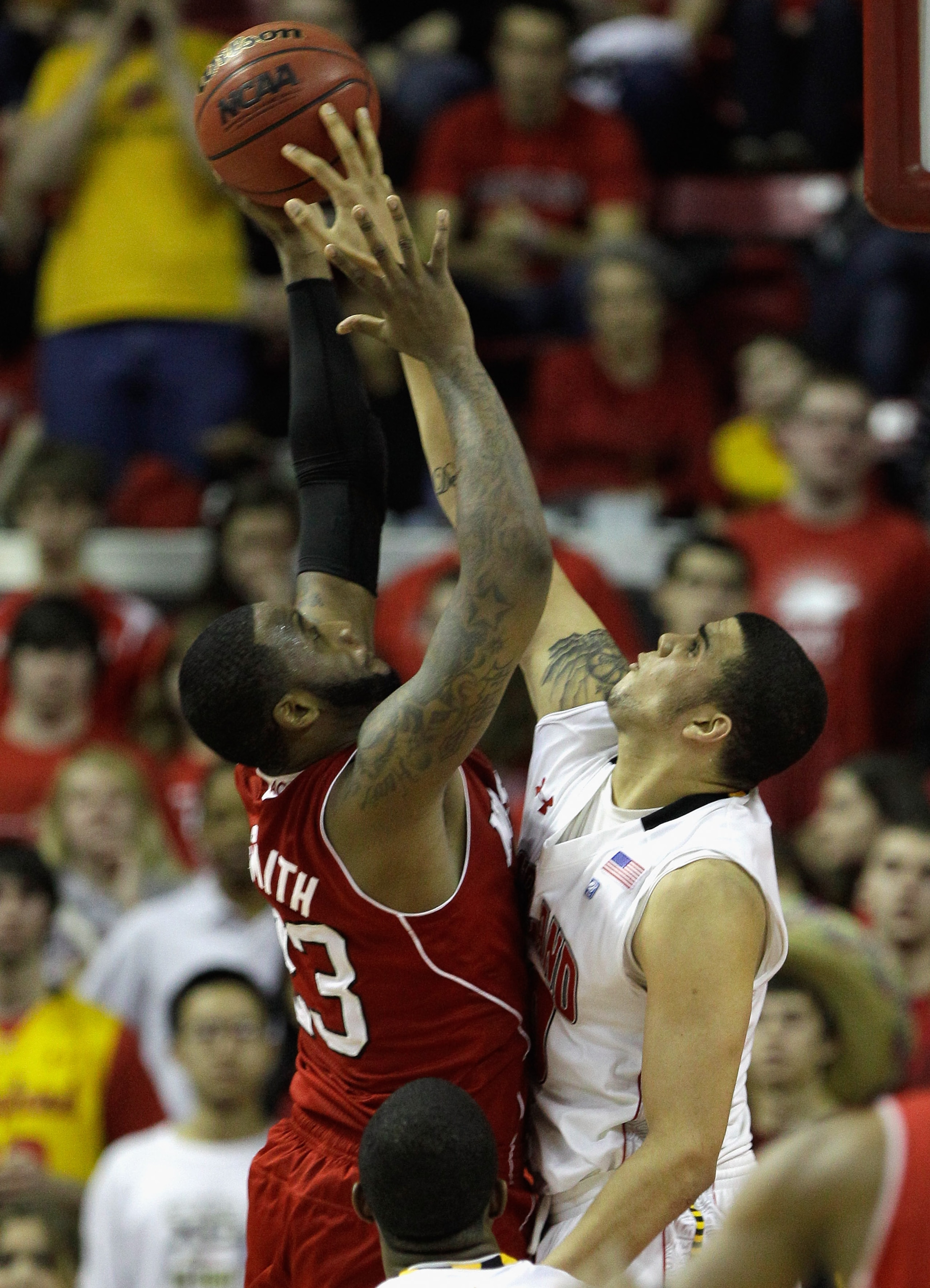 COLLEGE PARK, MD - FEBRUARY 20: Jordan Williams, right, of the  Maryland Terrapins blocks a shot by Tracy Smith, left, of the NC State Wolfpack at the Comcast Center on February 20, 2011 in College Park, Maryland.  (Photo by Rob Carr/Getty Images)