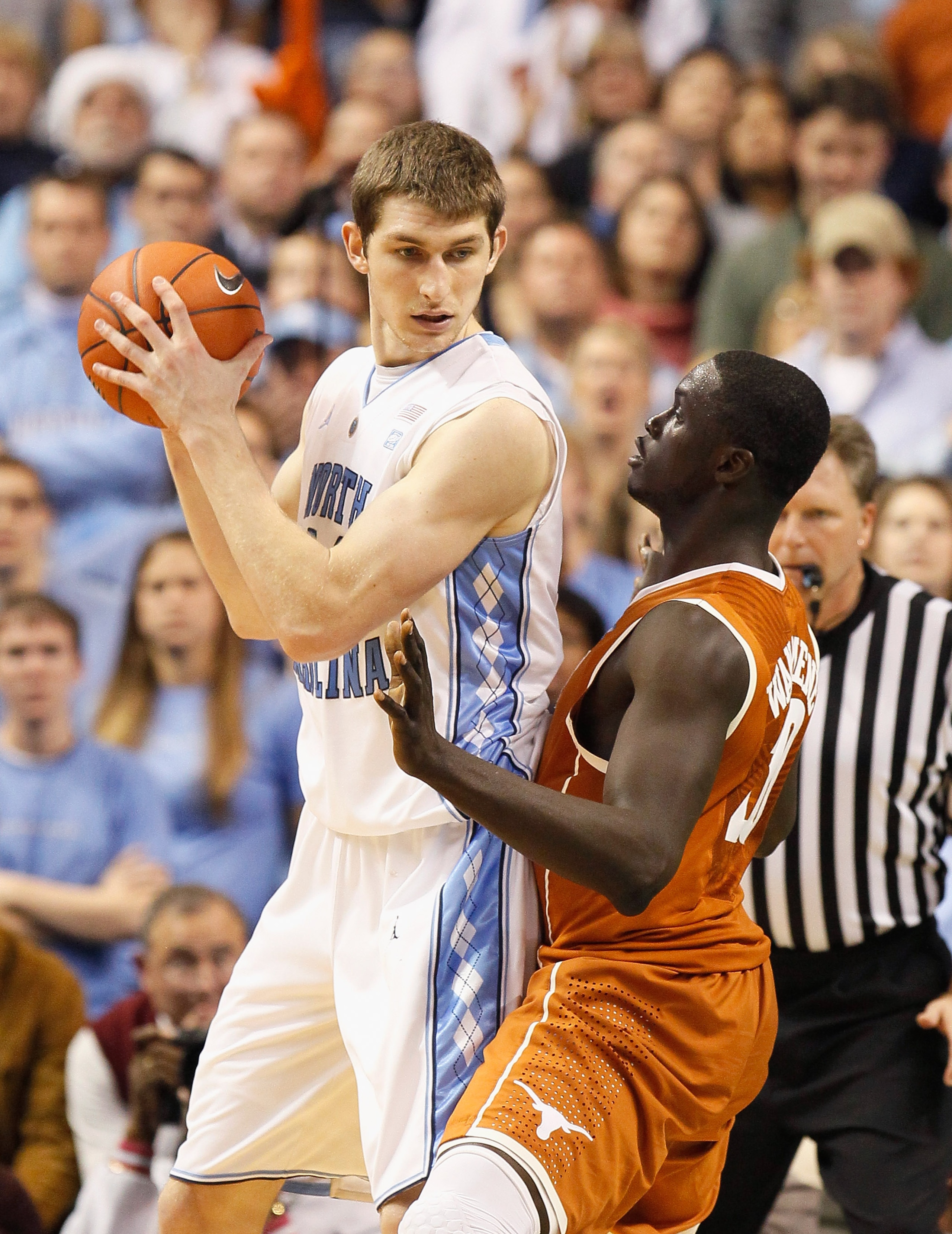 GREENSBORO, NC - DECEMBER 18:  Tyler Zeller #44 of the North Carolina Tar Heels against Alexis Wangmene #20 of the Texas Longhorns at Greensboro Coliseum on December 18, 2010 in Greensboro, North Carolina.  (Photo by Kevin C. Cox/Getty Images)