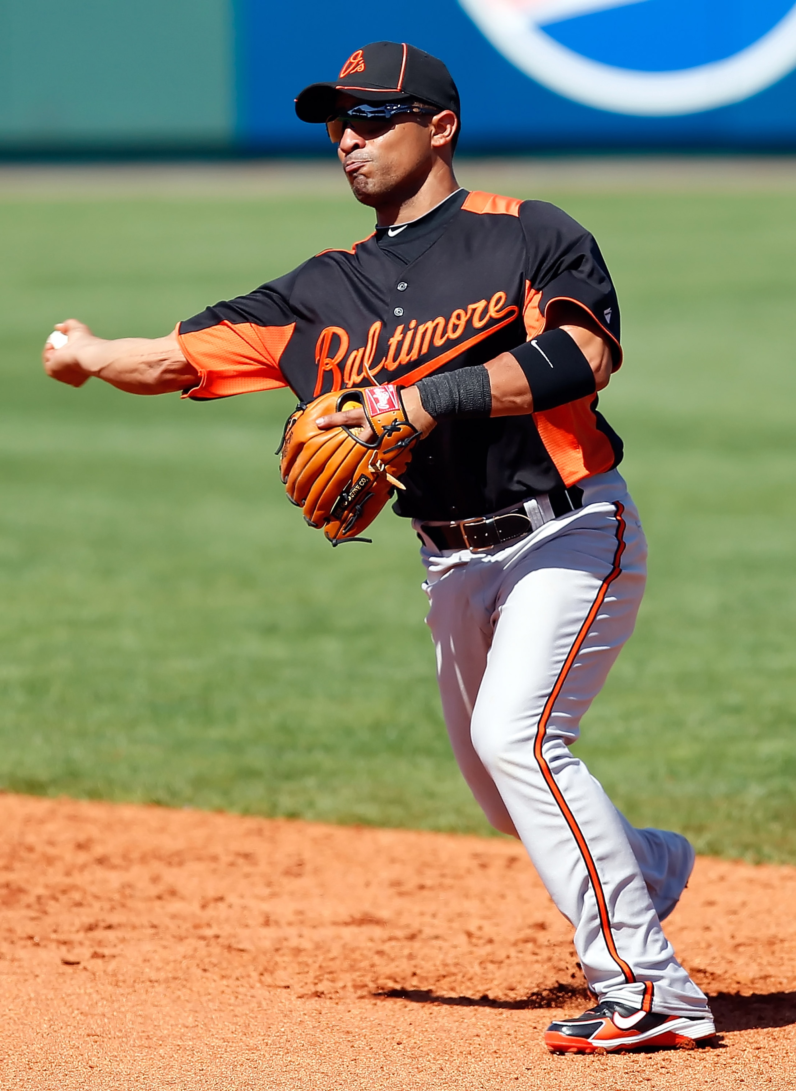 BRADENTON, FL - FEBRUARY 28: Infielder Cesar Izturis #3 of the Baltimore Orioles throws over to first for an out against the Pittsburgh Pirates during a Grapefruit League Spring Training Game at McKechnie Field on February 28, 2011 in Bradenton, Florida. BRADENTON, FL - FEBRUARY 28: Infielder Cesar Izturis #3 of the Baltimore Orioles throws over to first for an out against the Pittsburgh Pirates during a Grapefruit League Spring Training Game at McKechnie Field on February 28, 2011 in Bradenton, Florida.