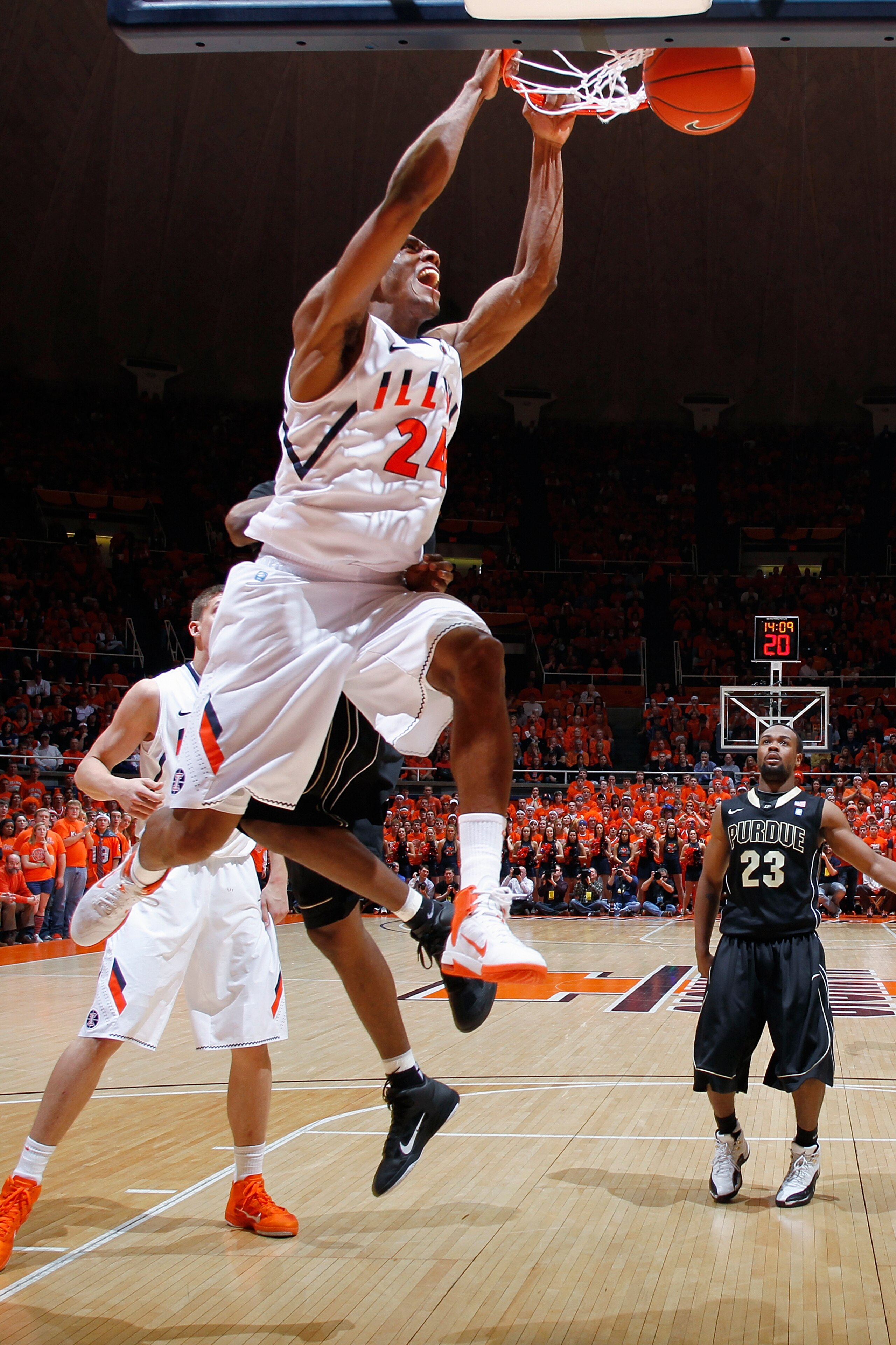 CHAMPAIGN, IL - FEBRUARY 13: Mike Davis #24 of the Illinois Fighting Illini dunks the ball against the Purdue Boilermakers at Assembly Hall on February 13, 2011 in Champaign, Illinois. Purdue defeated Illinois 81-70. (Photo by Joe Robbins/Getty Images)