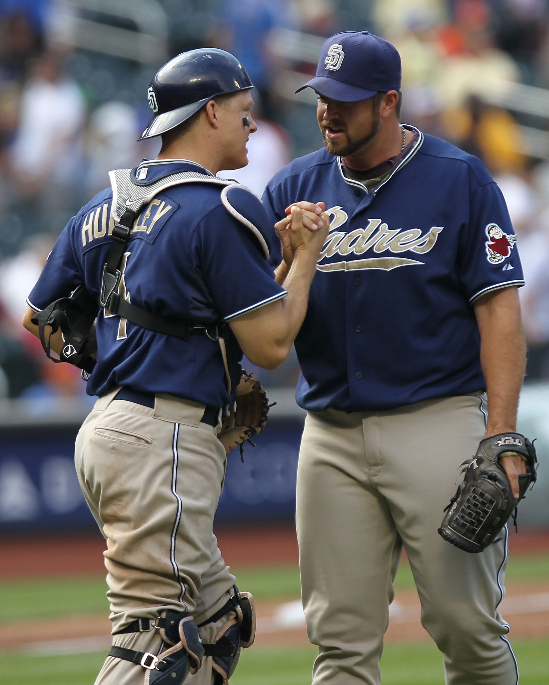 NEW YORK - JUNE 10:  Heath Bell #21 of the San Diego Padres celebrates the win with catcher Nick Hundley #4 against the New York Mets at Citi Field on June 10, 2010 in the Flushing neighborhood of the Queens borough of New York City.  (Photo by Nick Laham