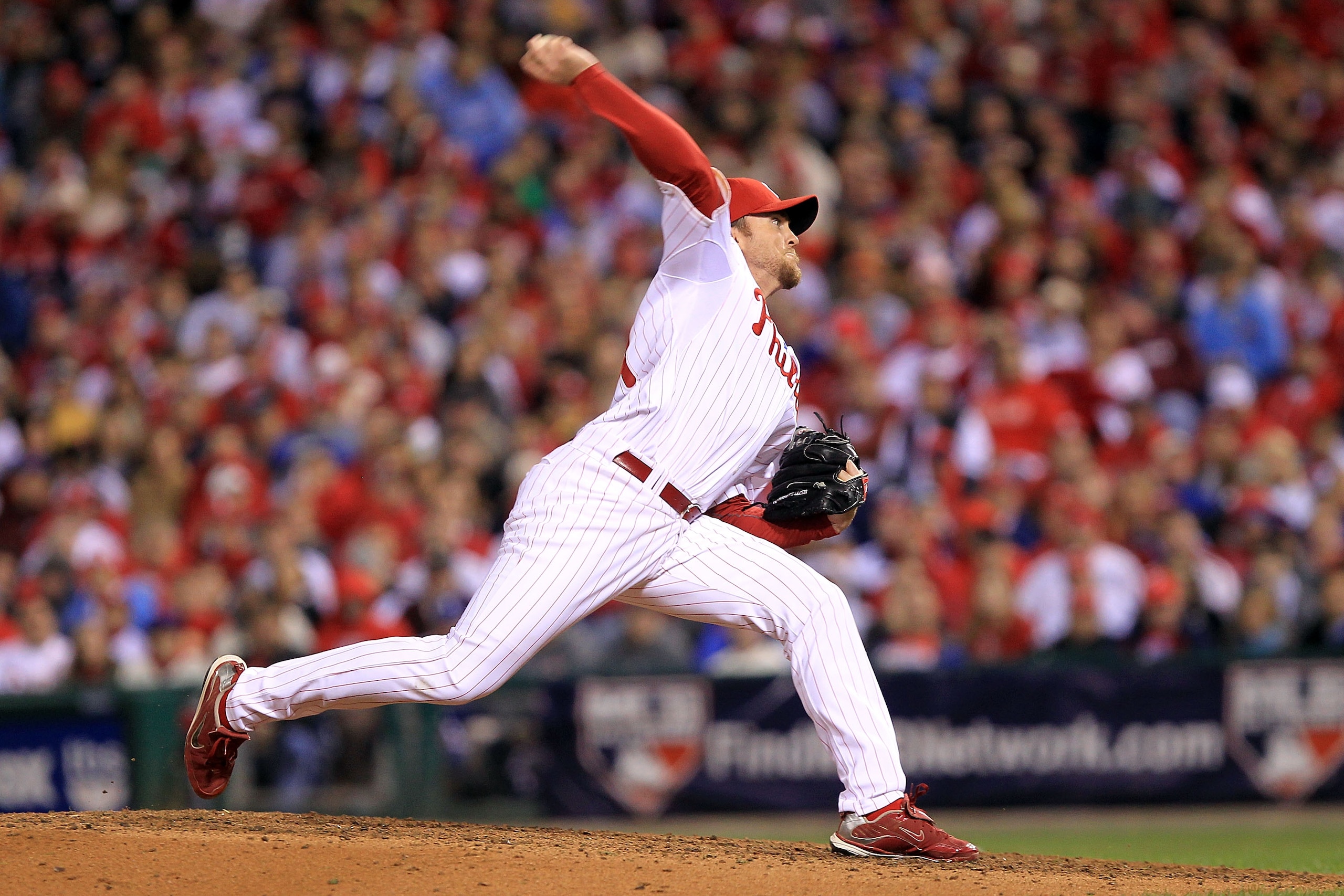 PHILADELPHIA - OCTOBER 16: Brad Lidge #54 of the Philadelphia Phillies pitches in the ninth inning against the San Francisco Giants in Game One of the NLCS during the 2010 MLB Playoffs at Citizens Bank Park on October 16, 2010 in Philadelphia, Pennsylvan PHILADELPHIA - OCTOBER 16: Brad Lidge #54 of the Philadelphia Phillies pitches in the ninth inning against the San Francisco Giants in Game One of the NLCS during the 2010 MLB Playoffs at Citizens Bank Park on October 16, 2010 in Philadelphia, Pennsylvan
