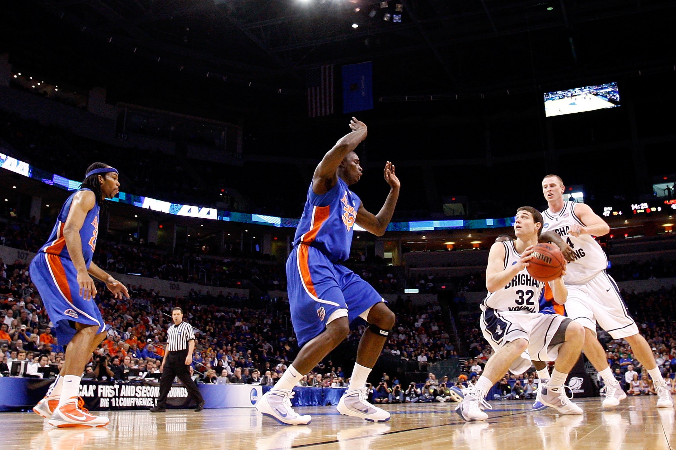 OKLAHOMA CITY - MARCH 18:  Jimmer Fredette #32 of the BYU Cougars looks to shoot the ball against Vernon Macklin #32 of the Florida Gators during the first round of the 2010 NCAA menï¿½s basketball tournament at Ford Center on March 18, 2010 in Oklahoma Cit