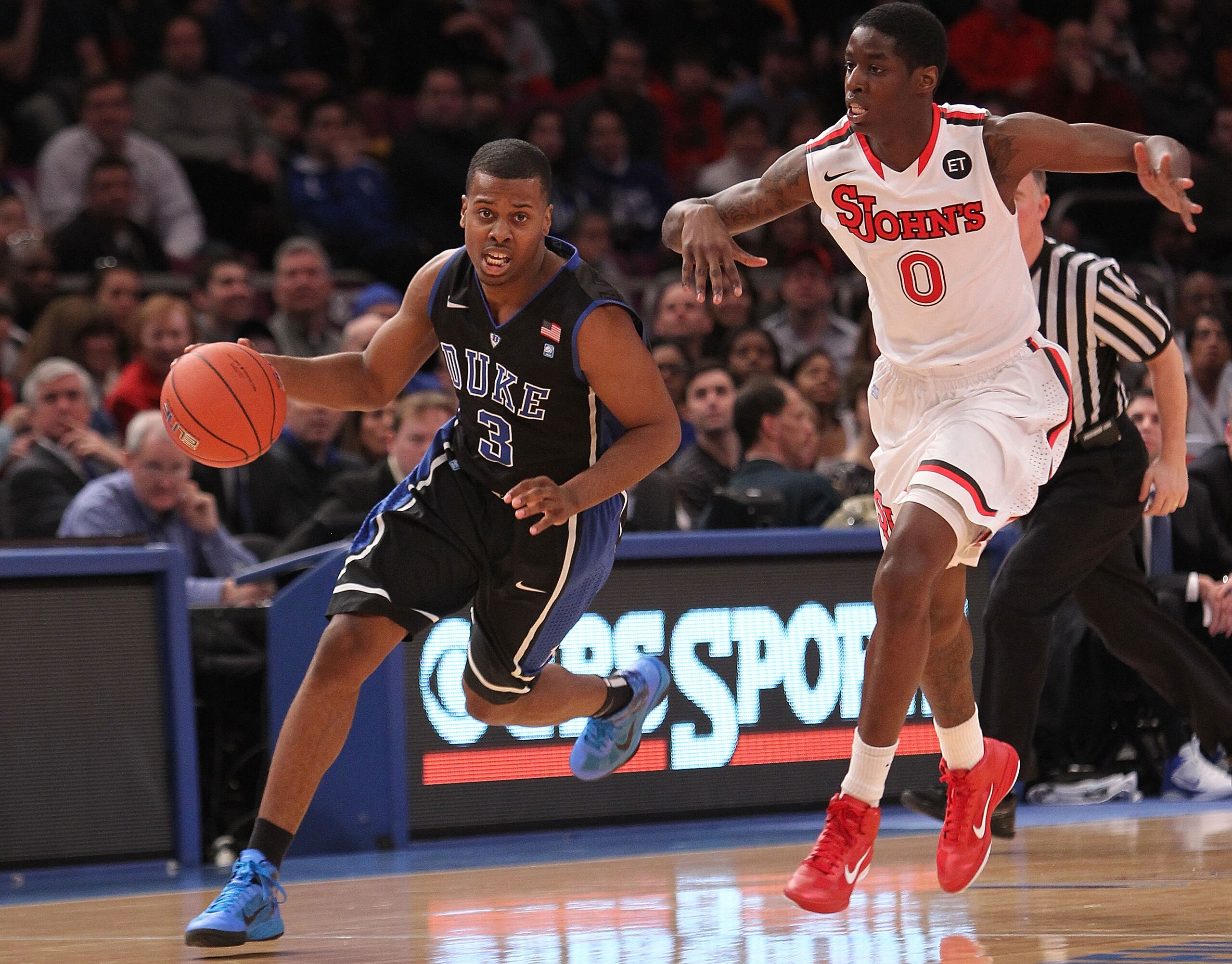 NEW YORK, NY - JANUARY 30: Tyler Thornton #3 of the Duke Blue Devils dribbles the ball against Dwayne Polee II #0 of the St. John's Red Storm at Madison Square Garden on January 30, 2011 in New York City. (Photo by Nick Laham/Getty Images) NEW YORK, NY - JANUARY 30: Tyler Thornton #3 of the Duke Blue Devils dribbles the ball against Dwayne Polee II #0 of the St. John's Red Storm at Madison Square Garden on January 30, 2011 in New York City. (Photo by Nick Laham/Getty Images)