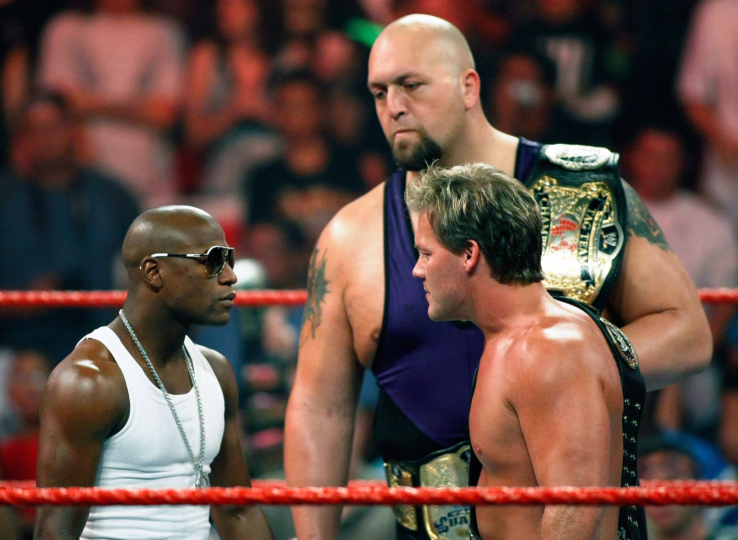 LAS VEGAS - AUGUST 24:  Boxer Floyd Mayweather Jr. (L) stares down wrestlers Chris Jericho and Big Show during the WWE Monday Night Raw show at the Thomas & Mack Center August 24, 2009 in Las Vegas, Nevada. Mayweather was a special guest host during the b