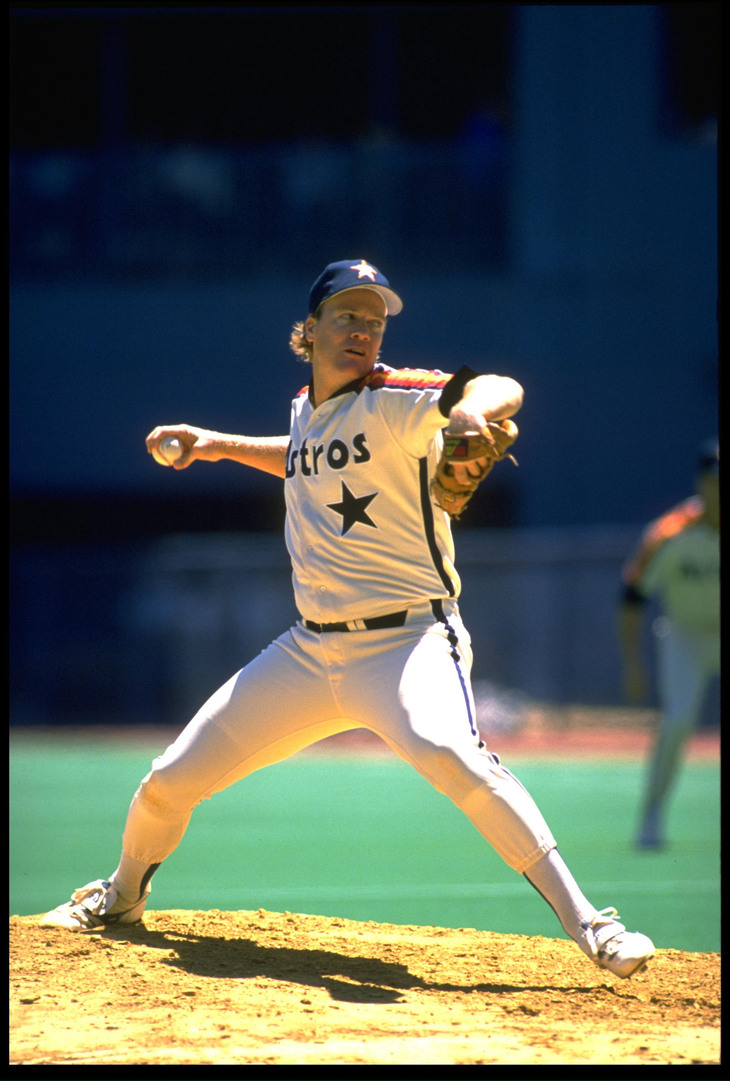 Pitcher Mike Scott of the Houston Astros throws a pitch from the pitchers mound.