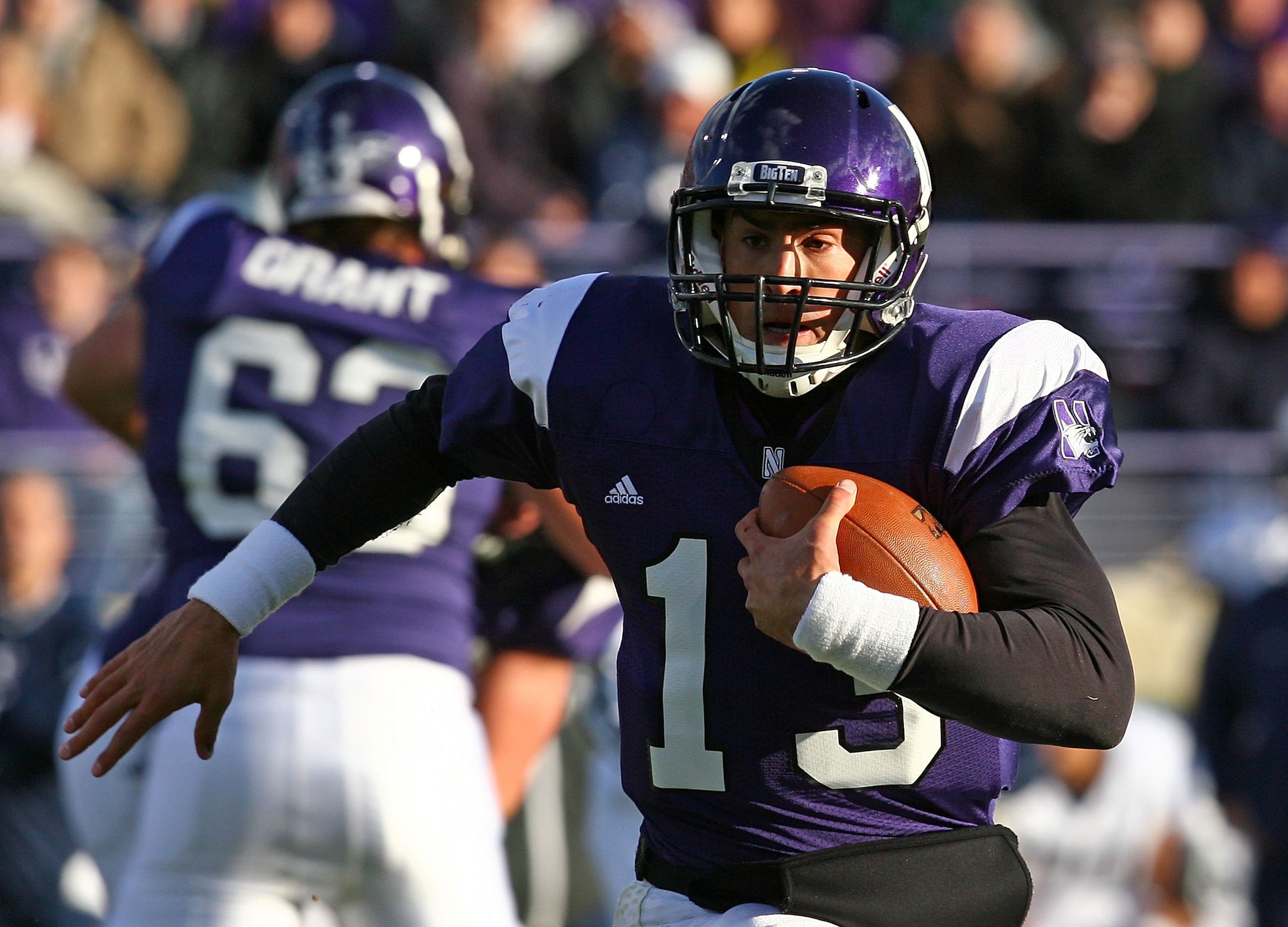 EVANSTON, IL - OCTOBER 31: Mike Kafka #13 of the Northwestern Wildcats runs for a first down against the Penn State Nittany Lions at Ryan Field on October 31, 2009 in Evanston, Illinois. (Photo by Jonathan Daniel/Getty Images)