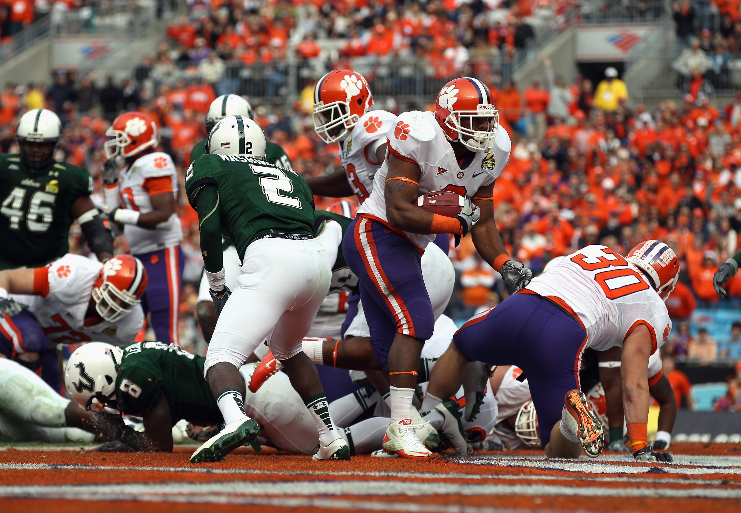 CHARLOTTE, NC - DECEMBER 31:  Jamie Harper #8 of the Clemson Tigers scores a touchdown against the USF Bulls during their game at Bank of America Stadium on December 31, 2010 in Charlotte, North Carolina.  (Photo by Streeter Lecka/Getty Images)