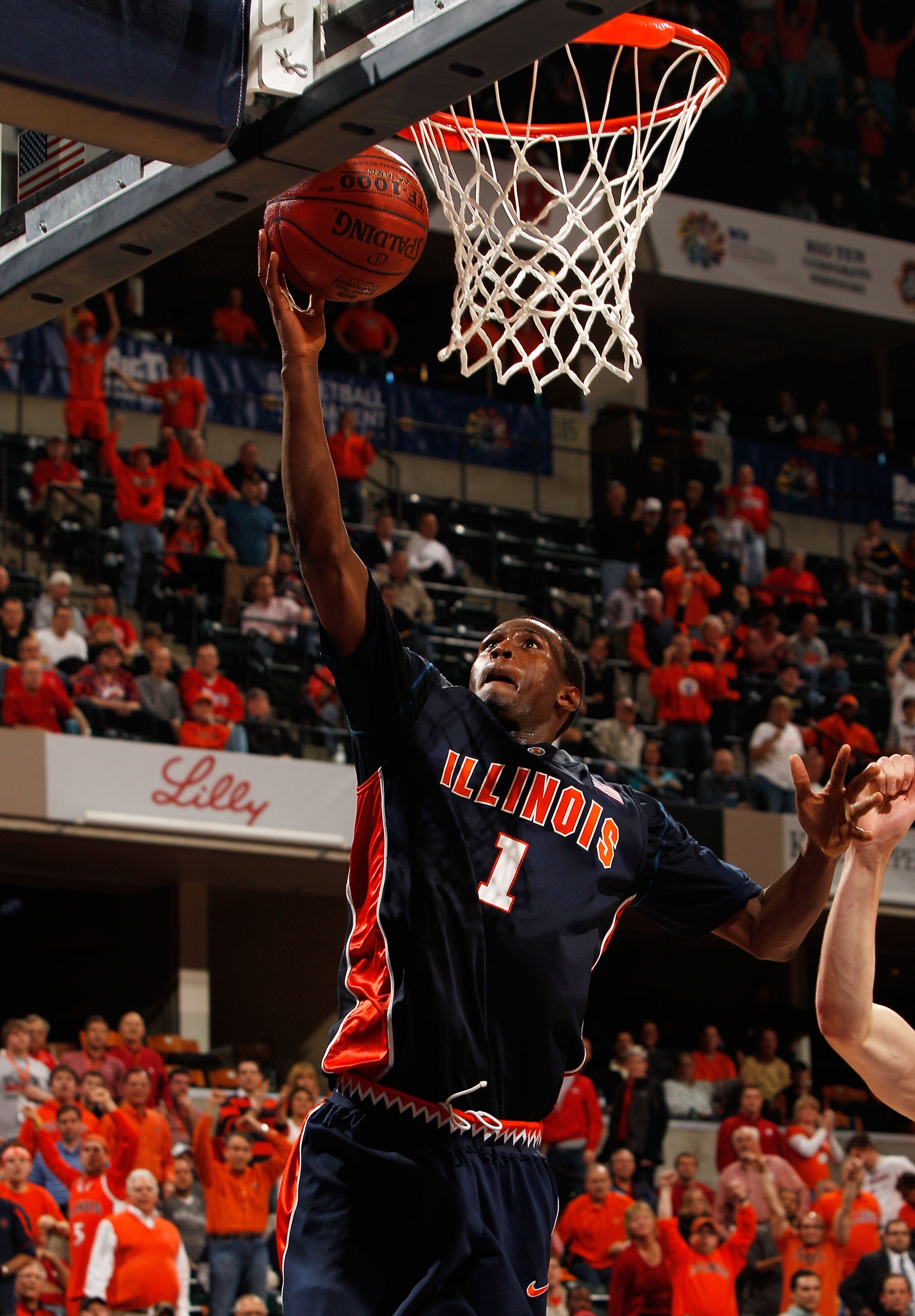 INDIANAPOLIS - MARCH 12:  Guard D.J. Richardson #1 of the Illinois Fighting Illini attempts a layup against the Wisconsin Badgers during the quarterfinals of the Big Ten Men's Basketball Tournament at Conseco Fieldhouse on March 12, 2010 in Indianapolis,