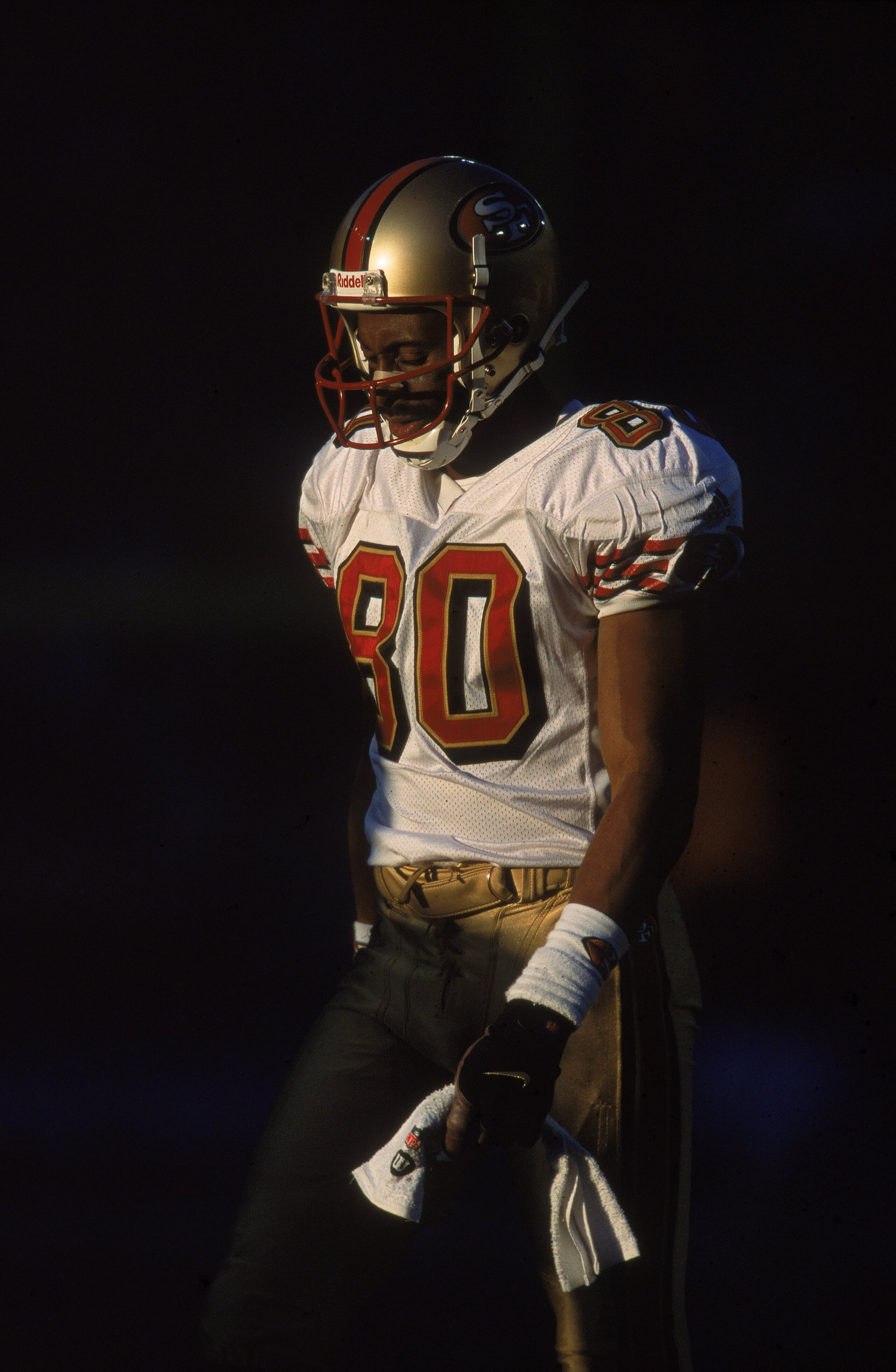 23 Dec 2000:  Jerry Rice #80 of the San Francisco 49ers walks and looks down during the game against the Denver Broncos at the Mile High Stadium in Denver, Colorado. The Broncos defeated the 49ers 38-9.Mandatory Credit: Brian Bahr  /Allsport