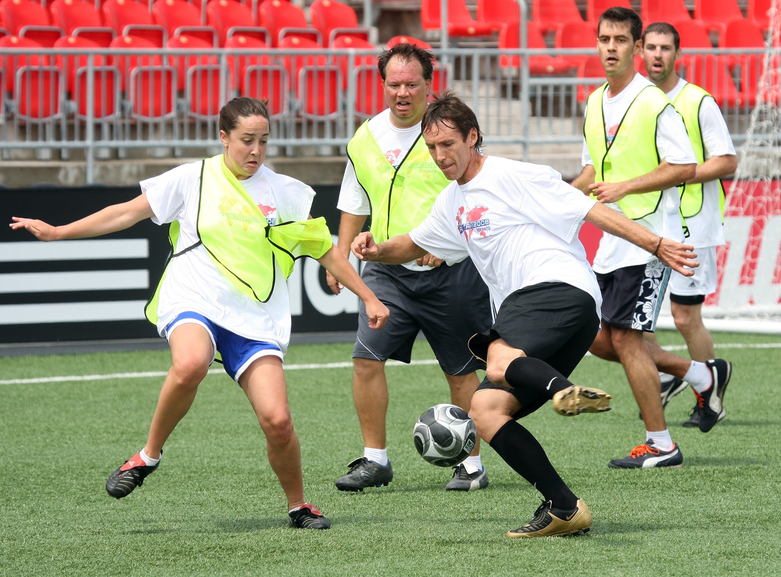 TORONTO - JULY 24:  NBA basketball player Steve Nash battles with MLS Media PR coordinator Susan Marschall during the MLS All-Star media game at BMO Field on July 24, 2008 in Toronto, Canada. (Photo by Claus Andersen/Getty Images for the MLS)