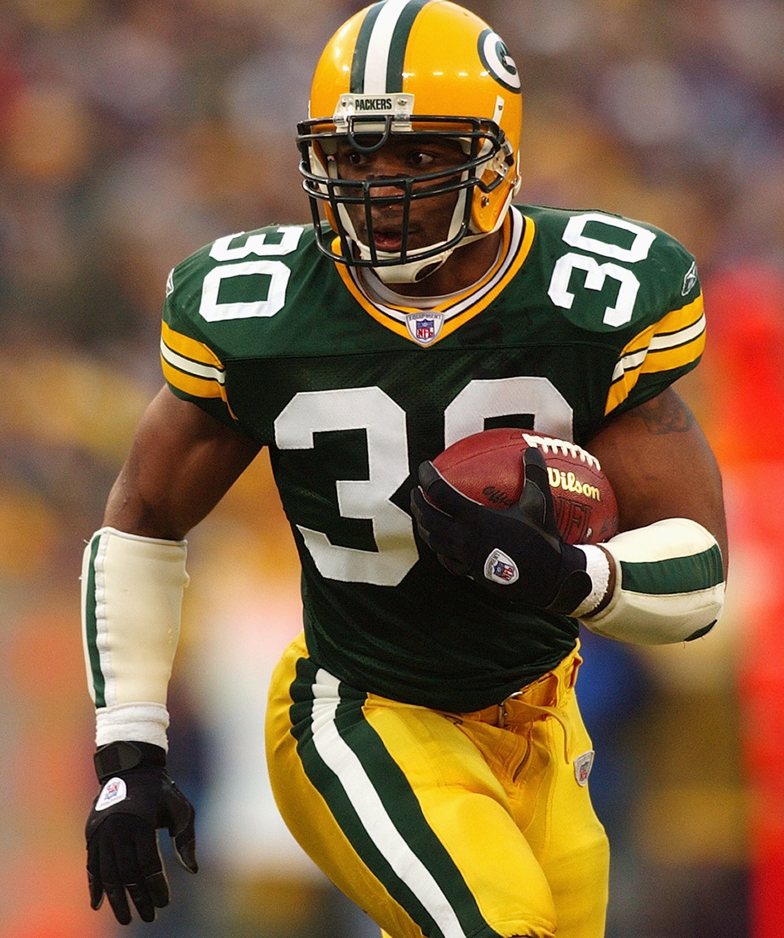 GREEN BAY, WI - DECEMBER 28:  Running back Ahman Green #30 of the Green Bay Packers runs the football during the game against the Denver Broncos on December 28, 2003 at Lambeau Field in Green Bay, Wisconsin. The Packers defeated the Broncos 31-3 to win th