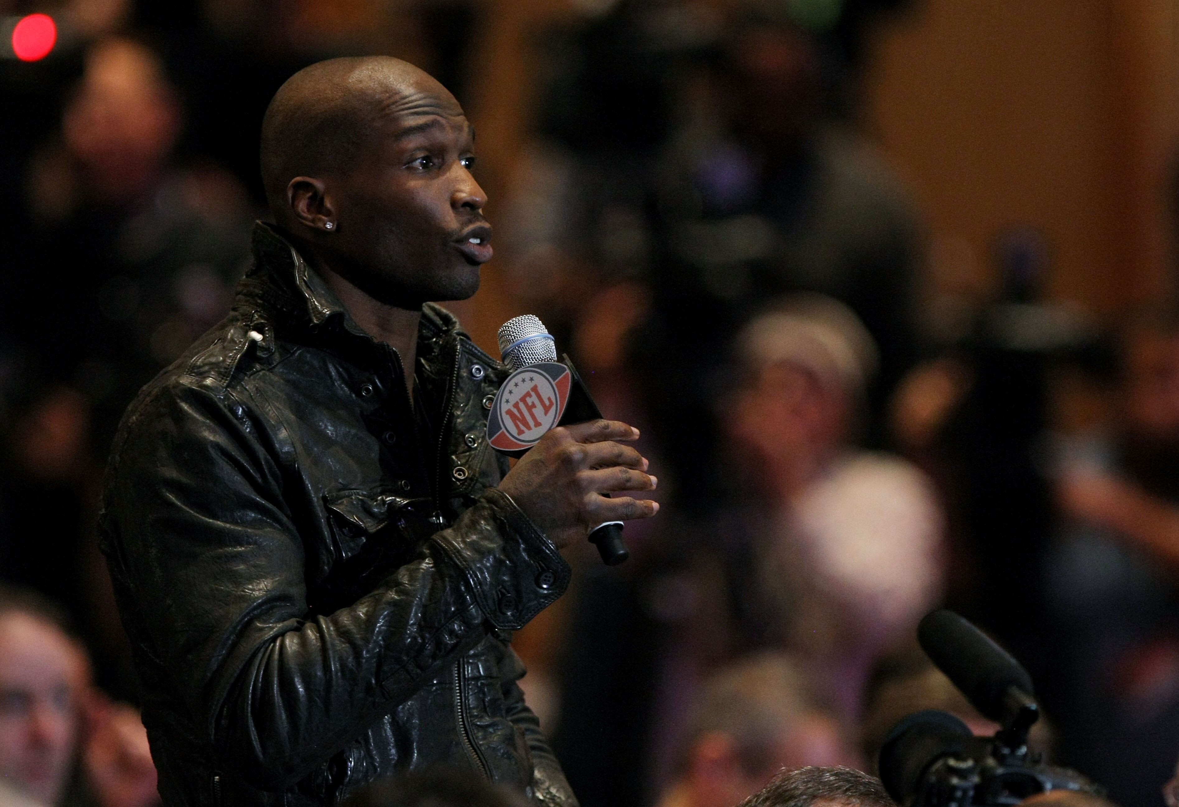 DALLAS, TX - FEBRUARY 04:  Chad Ochocinco of the Cincinnati Bengals asks NFL commissioner Roger Goodell a question during a press conference at the Super Bowl XLV media center on February 4, 2011 in Dallas, Texas. The Green Bay Packers will play the Pitts