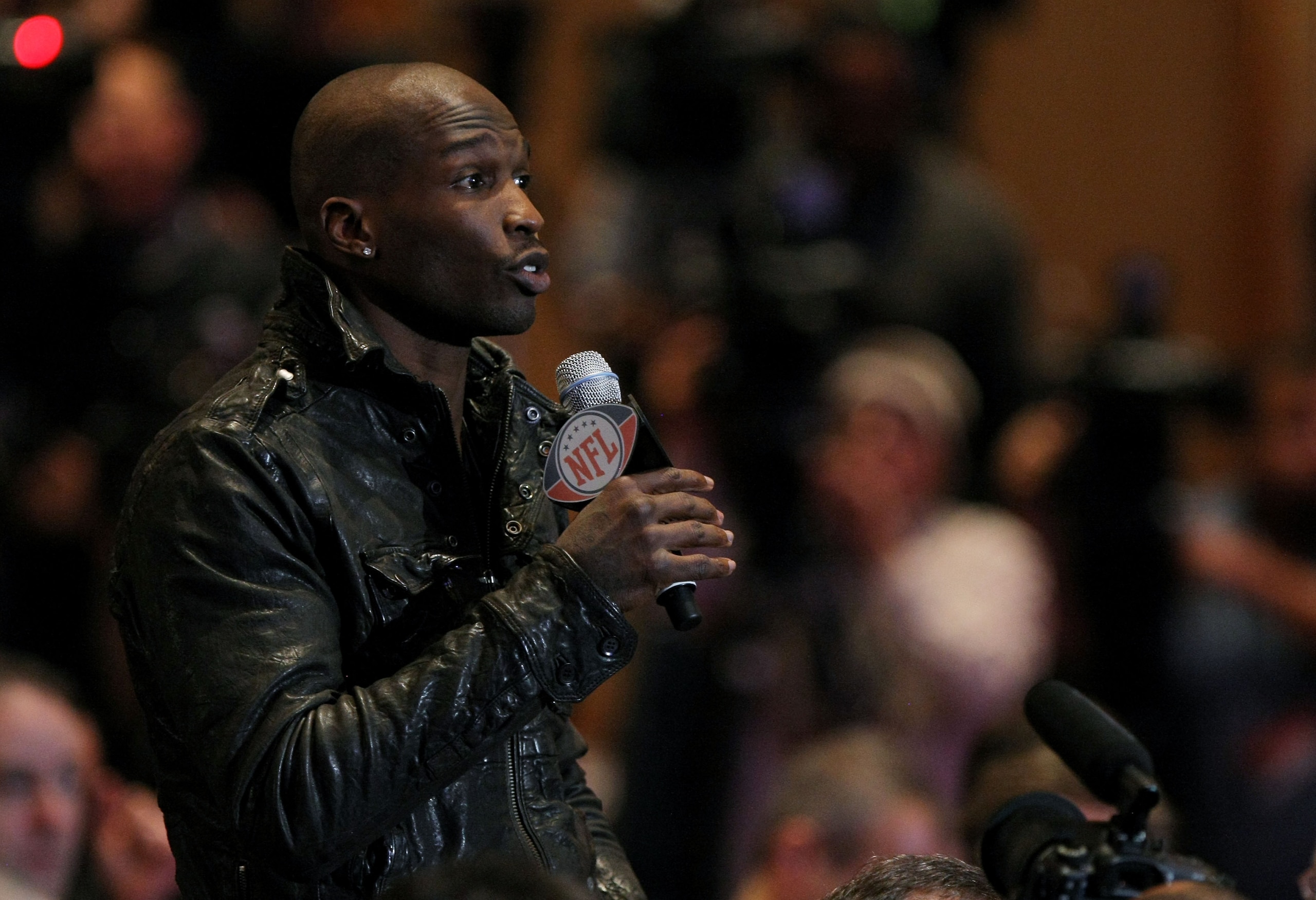 DALLAS, TX - FEBRUARY 04:  Chad Ochocinco of the Cincinnati Bengals asks NFL commissioner Roger Goodell a question during a press conference at the Super Bowl XLV media center on February 4, 2011 in Dallas, Texas. The Green Bay Packers will play the Pitts