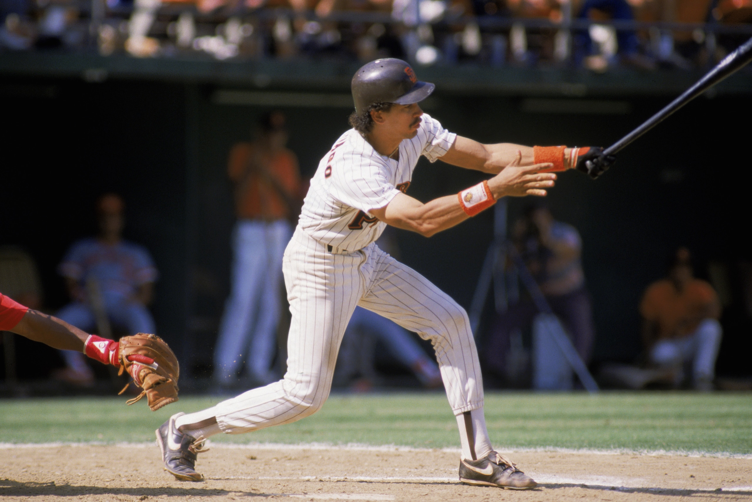 SAN DIEGO - 1987:  Catcher Benito Santiago #9 of the San Diego Padres swings at the pitch during an MLB game against the Cincinnati Reds at Jack Murphy Stadium during the 1987 season in San Diego, California.  In that year, Santiago recorded a new ML-rook