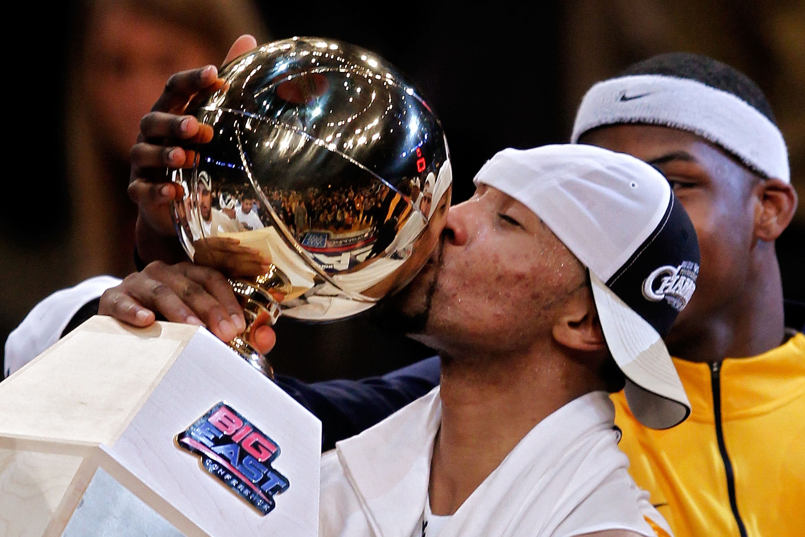 NEW YORK - MARCH 13:  Da'Sean Butler #1 of the West Virginia Mountaineers kisses the championship trophy after defeating the Georgetown Hoyas during the championship of the 2010 NCAA Big East Tournament at Madison Square Garden on March 13, 2010 in New Yo
