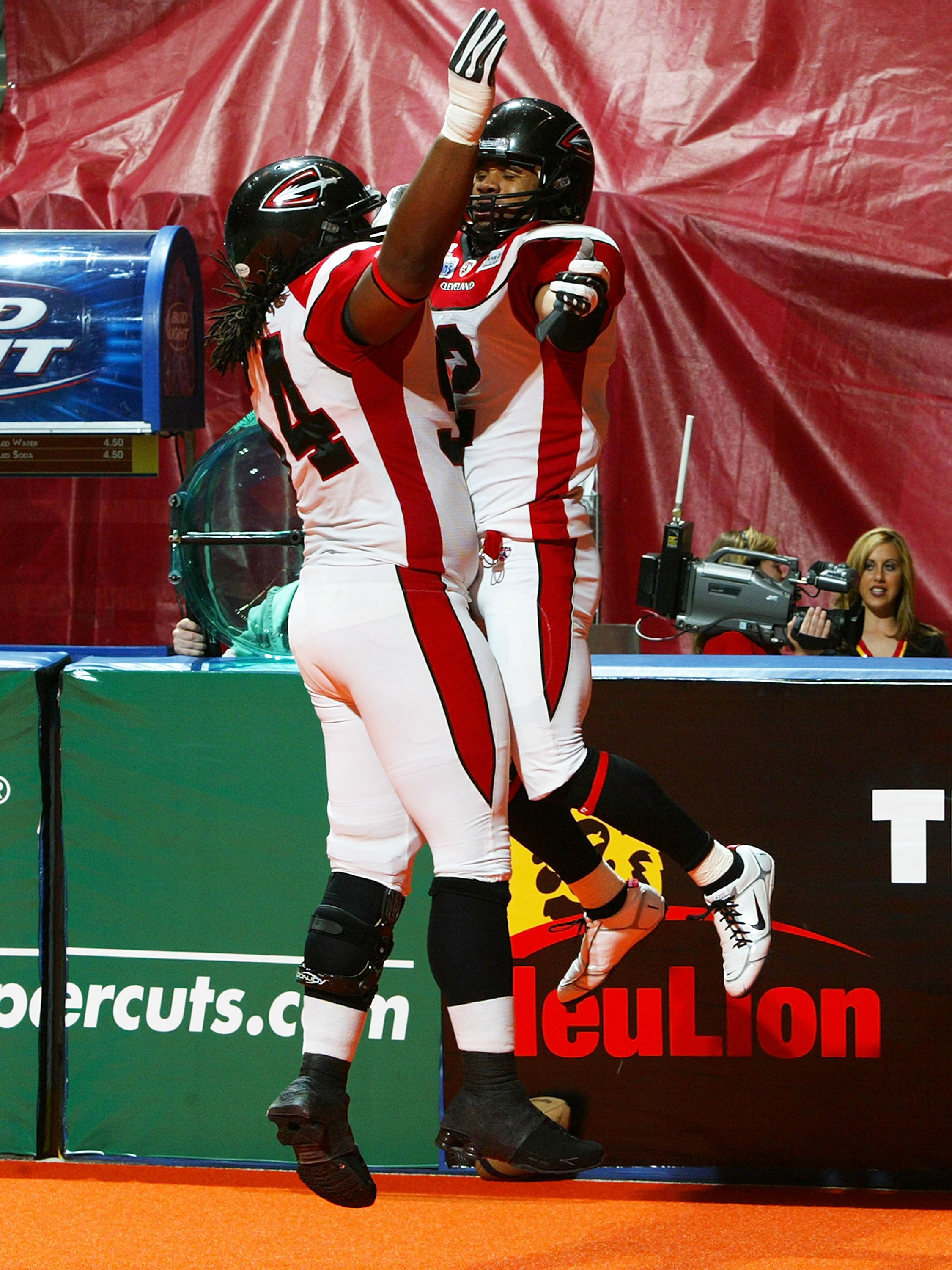 UNIONDALE, NY - APRIL 26: Robert Redd #2 of the Cleveland Gladiators celebrates his first half touchdown with teammate Brandon Hefflin #24 against the New York Dragons on April 26, 2008 at Nassau Coliseum in Uniondale, New York. Dragons defeat Gladiator