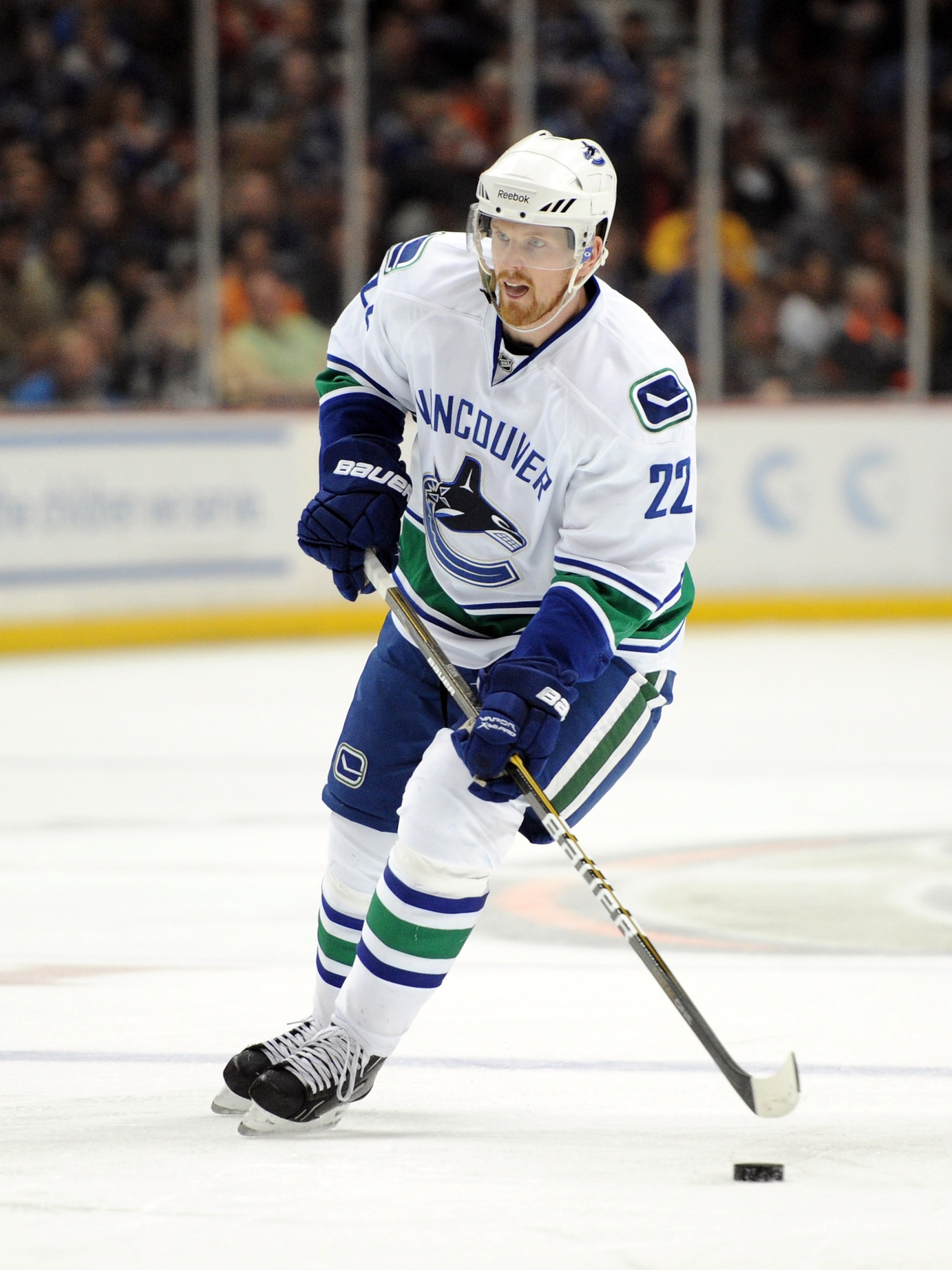 ANAHEIM, CA - MARCH 06:  Daniel Sedin #22 of the Vancouver Canucks controls the puck at the point against the Anaheim Ducks at the Honda Center on March 6, 2011 in Anaheim, California.  (Photo by Harry How/Getty Images)