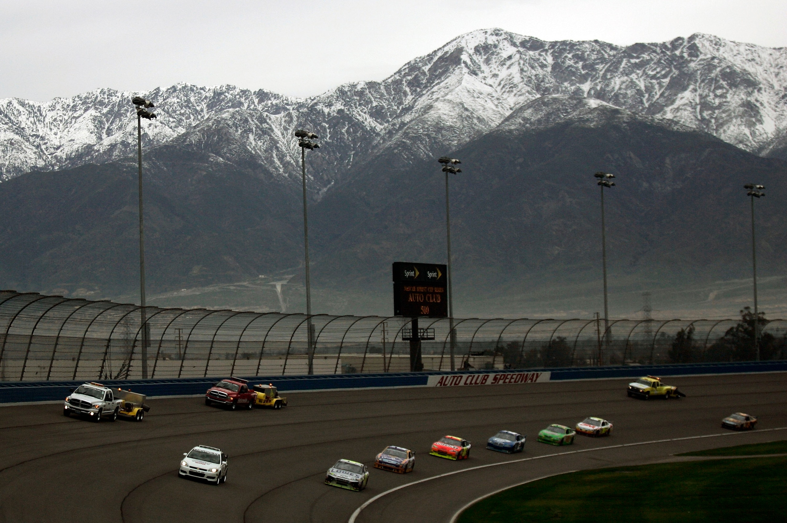 FONTANA, CA - FEBRUARY 22: The pace car leads the field, under caution for rain through turn three and past the track dryers during the NASCAR Sprint Cup Series Auto Club 500 at Auto Club Speedway on February 22, 2009 in Fontana, California.  (Photo by Ja