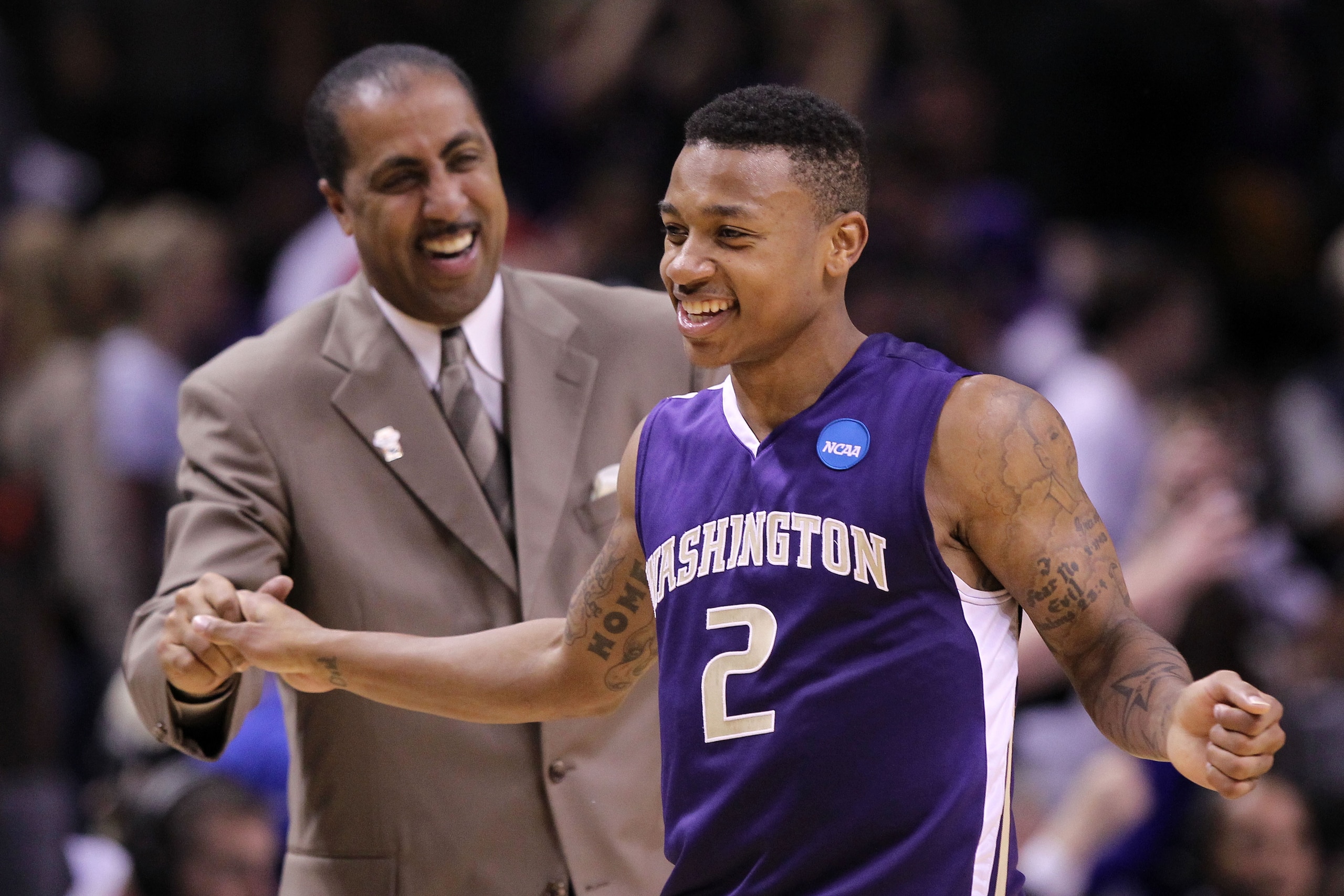 SAN JOSE, CA - MARCH 20:  Guard Isaiah Thomas #2 and head coach Lorenzo Romar of the Washington Huskies celebrate after their 82-64 win over the New Mexico Lobos in the second round of the 2010 NCAA men's basketball tournament at HP Pavilion on March 20,
