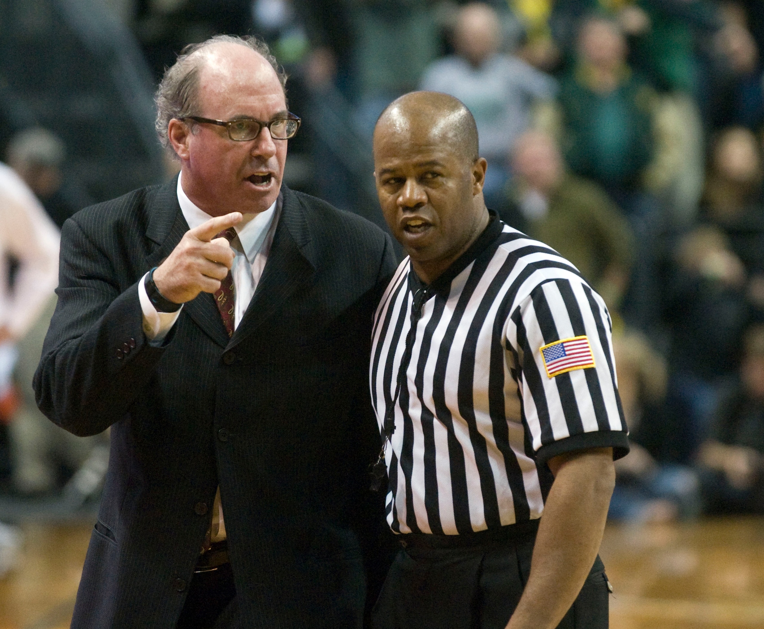 EUGENE, OR - JANUARY 13: Head coach Kevin O'Neill of the USC Trojans has some words with an official during the second half of the game against the Oregon Ducks  at Matthew Knight Arena on January 13, 2011 in Eugene, Oregon. Oregon won the game 68-62. The