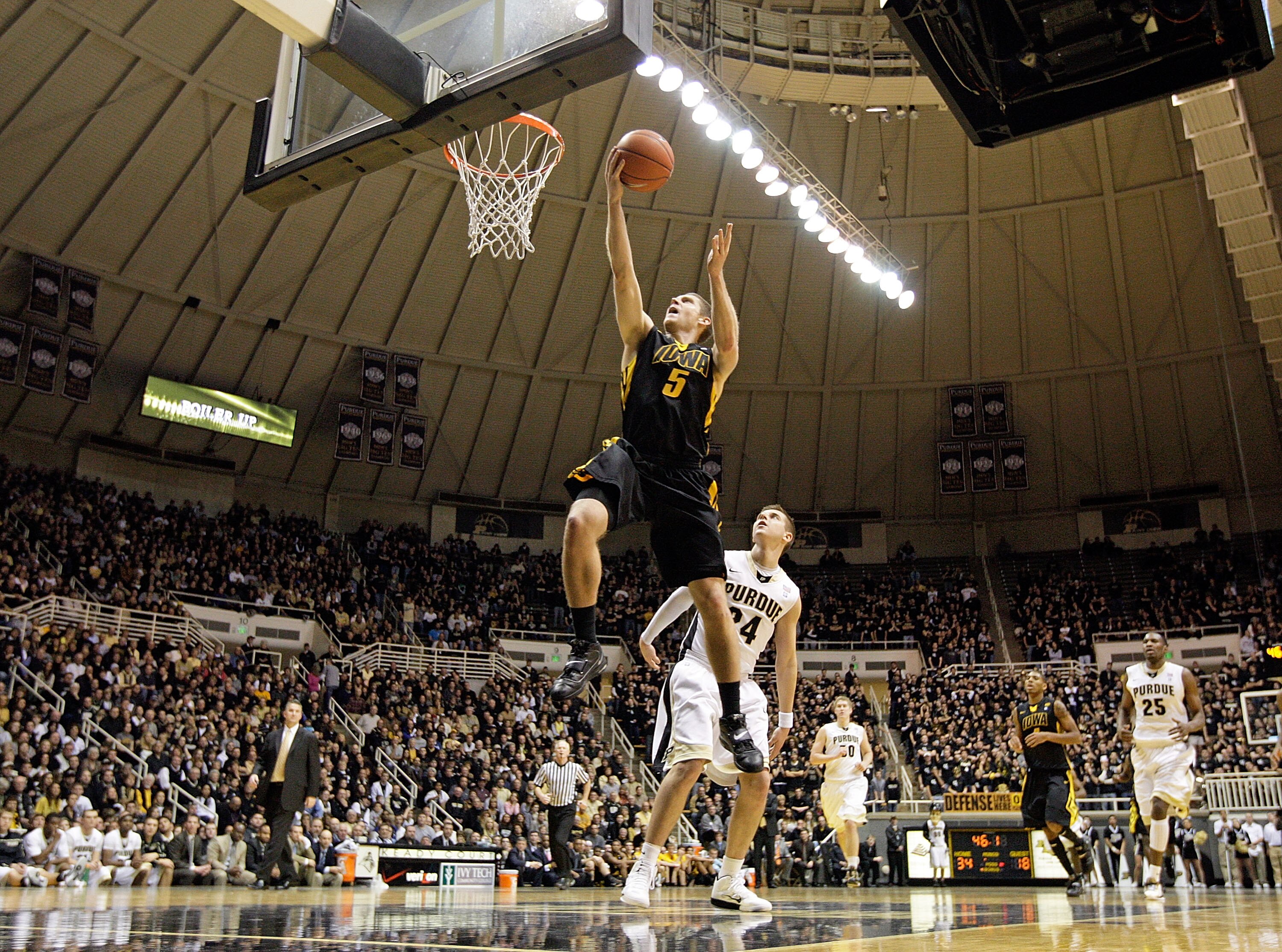 WEST LAFAYETTE, IN - JANUARY 09:  Matt Gatens #5 of the Iowa Hawkeyes drives for a shot attempt during the Big Ten Conference game against the Purdue Boilermakers at Mackey Arena on January 9, 2011 in West Lafayette, Indiana. Purdue won 75-52. (Photo by A